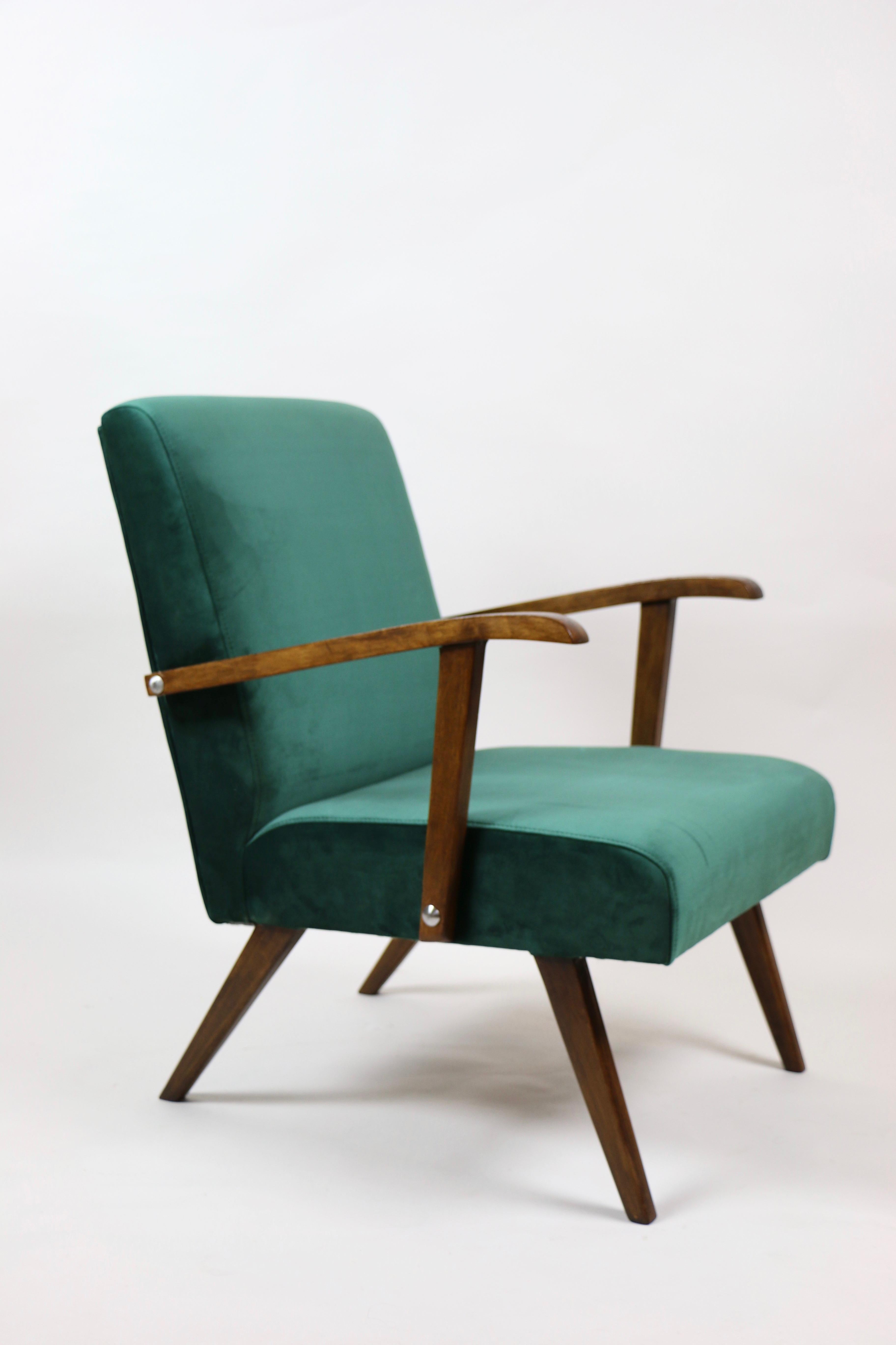 Small vintage club armchair design in green made velvet from 1970s, new upholstery covered with velvet fabric in fashionable green color, finished with wooden chair cushion. Wooden elements in dark oak color. Perfect condition. This model is one of