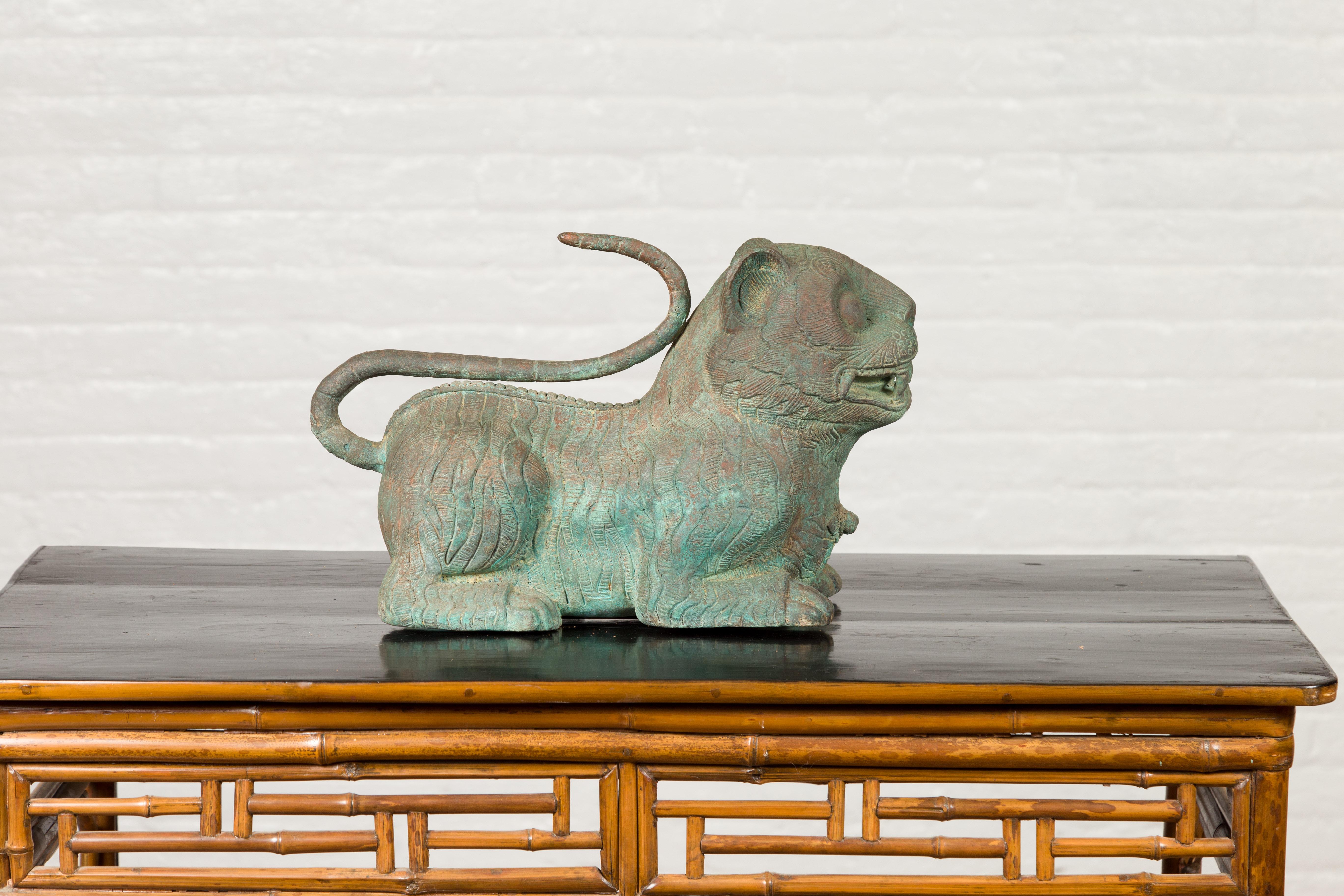 A vintage cast bronze mythical animal sculpture from the mid-20th century, with verde patina. Created with the traditional technique of the lost-wax (à la cire perdue) that allows a great precision and finesse in the details, this bronze sculpture