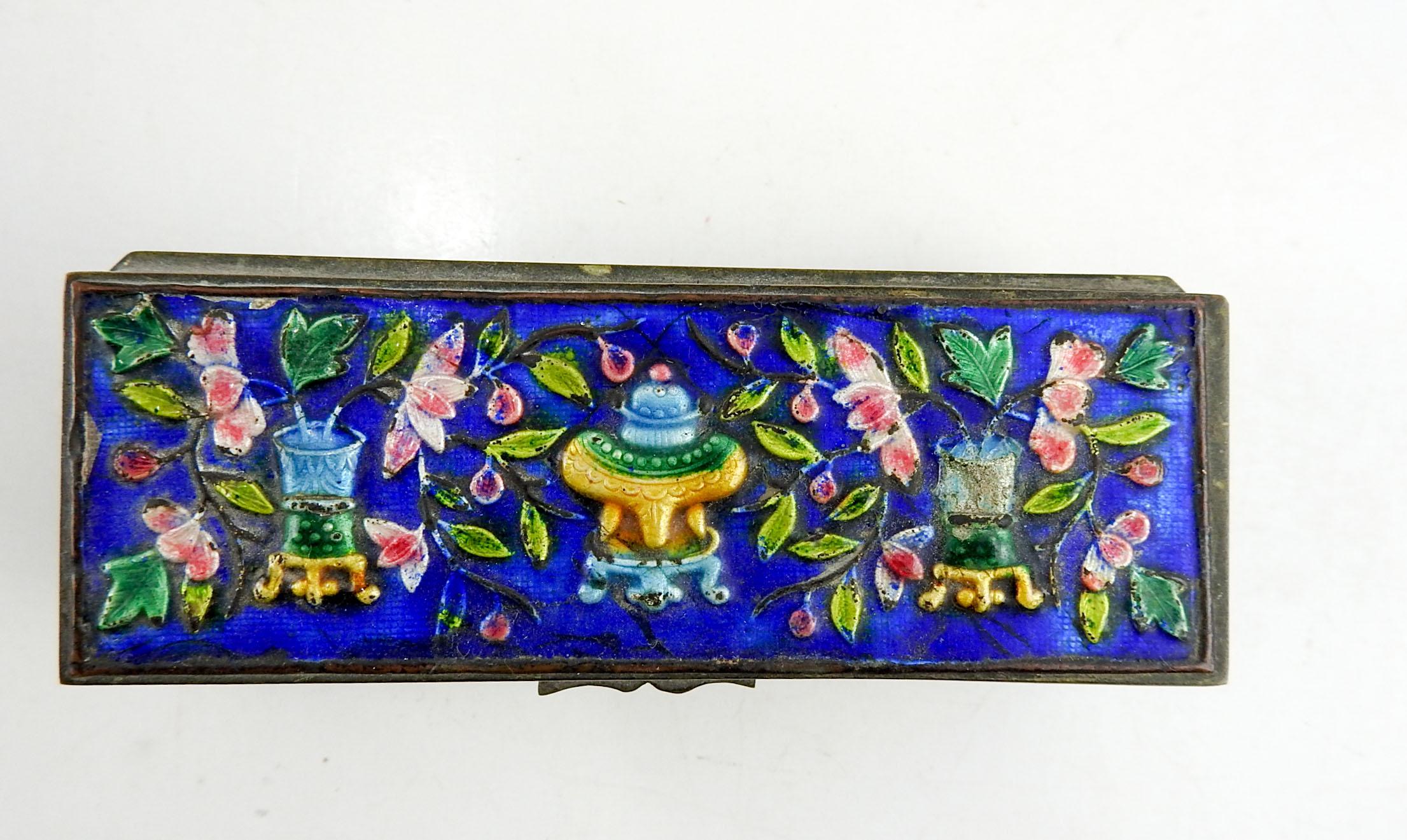 Small vintage brass stamp box with enamel decoration. Marked China on bottom and sloped interior bottom. Overall patina with a few tiny dings to enamel.