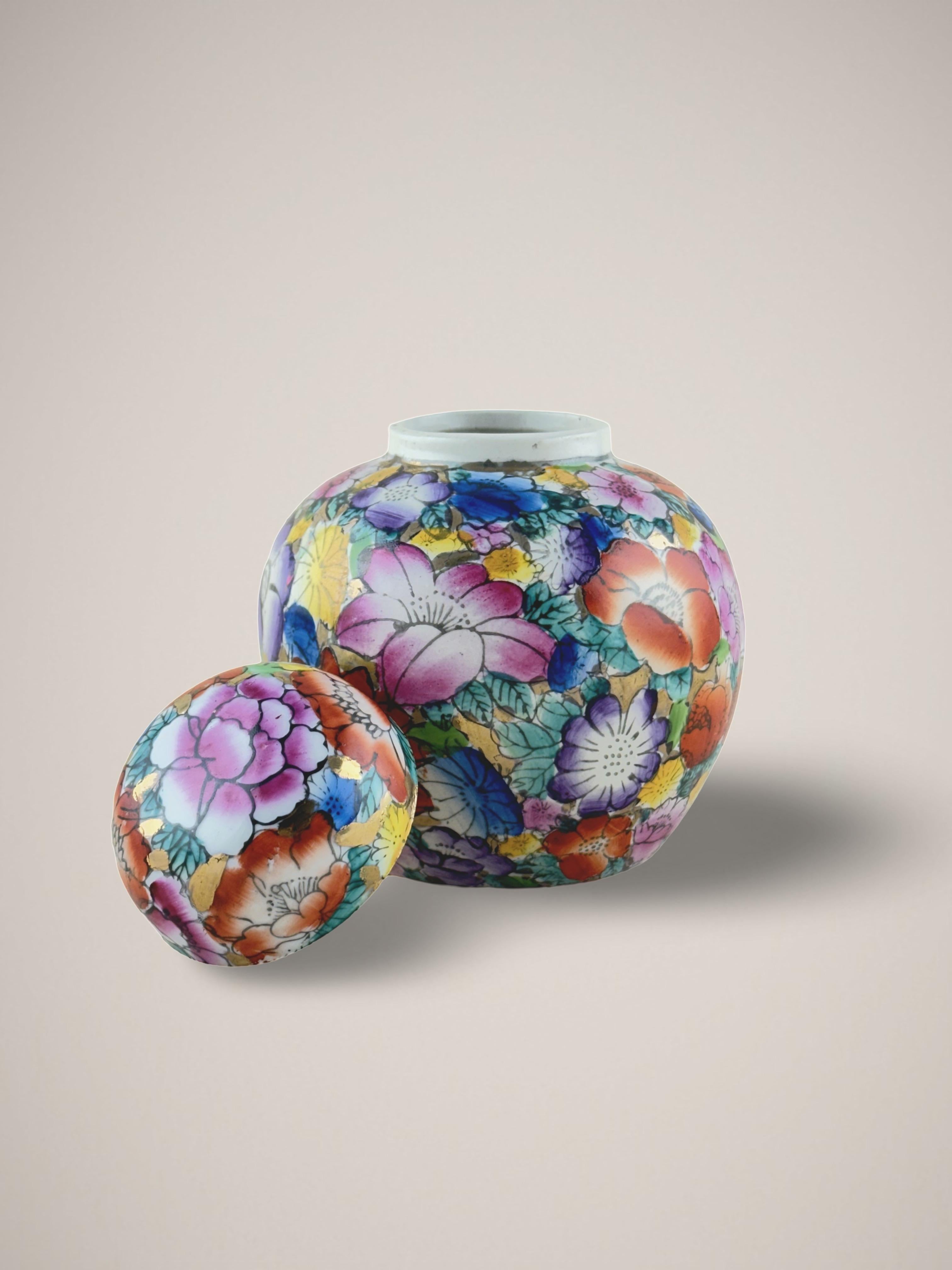 A small porcelain ginger jar, crafted in China during the 1980s.

Hand-painted with the bright and colorful Chinese 'Mille Fleur' style, meaning 'Thousand Flowers'. This vibrant style is characterized by a dense tapestry of blooming flowers: