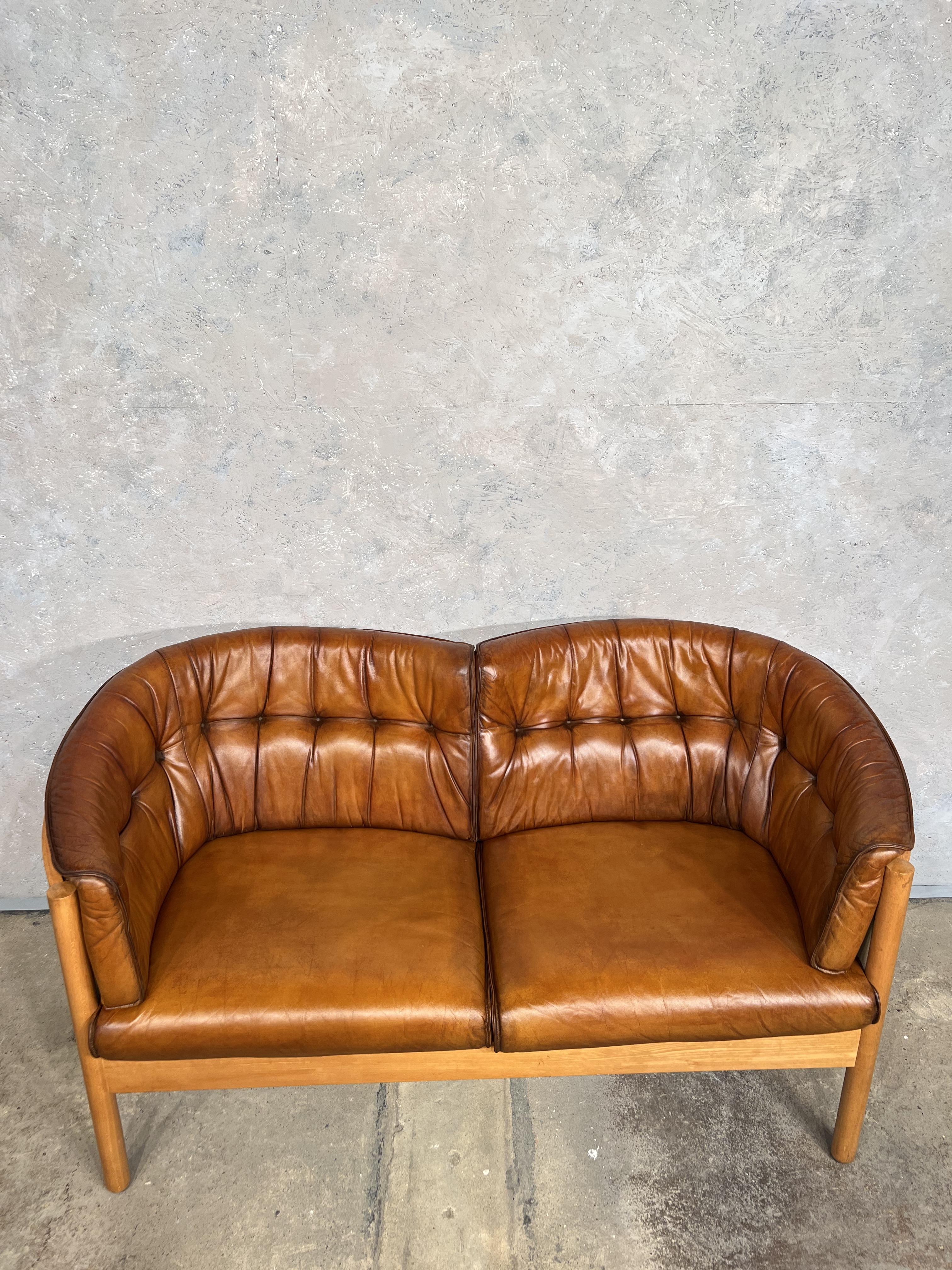 Small Vintage Danish 70 two seater leather sofa with a solid Beech frame, fantastic quality by Nielaus Møbler Denmark.


Stylish with neat proportions, hand dyed a patinated light tan with a great patina and finish.

Excellent
