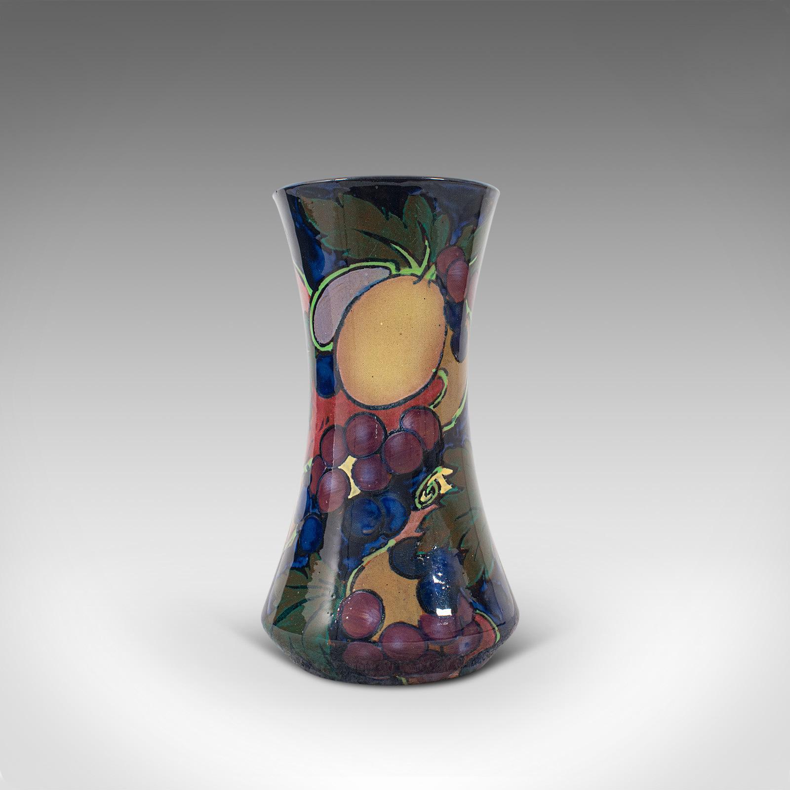 This is a small vintage decorative vase. An English, ceramic baluster flower display vase, dating to the early 20th century, circa 1930.

Pleasingly colorful and diminutive in form
Displays a desirable aged patina
Ceramic in good order with