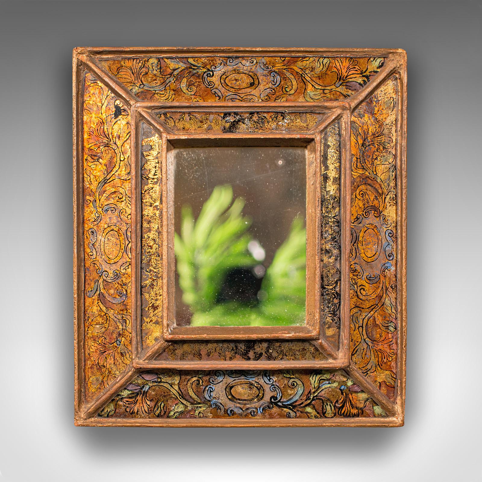 This is a small vintage eglomise mirror. An Italian, decorative cushion vanity mirror, dating to the mid 20th century, circa 1950.

Charmingly decorative mirror with distinctive frame
Displays a desirable aged patina and in good