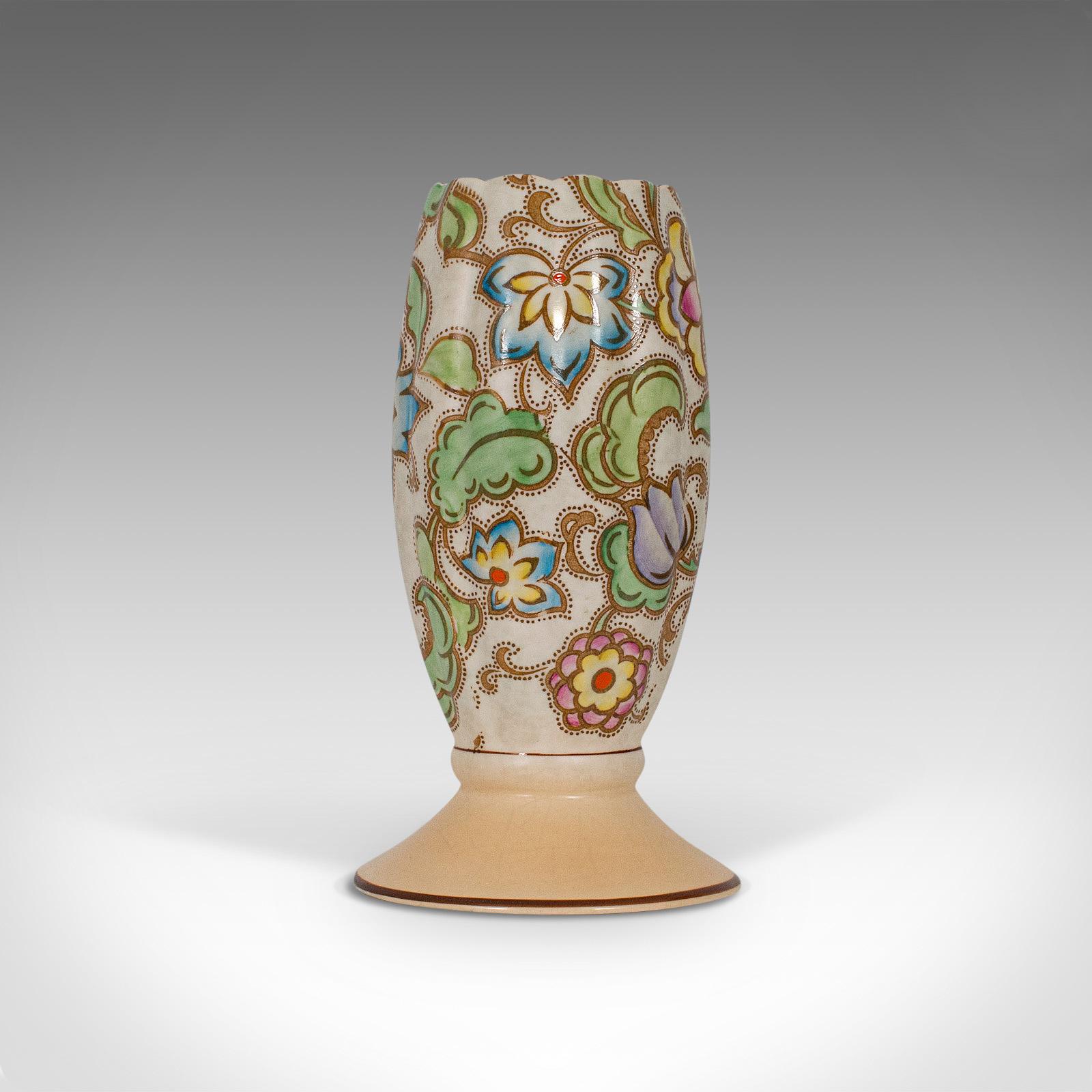 This is a small vintage flower vase. An English, ceramic goblet urn in Art Deco taste, dating to the mid-20th century, circa 1940.

Charming, unusual goblet form
Displays a desirable aged patina
Ceramic in good order with bright glaze
Hand