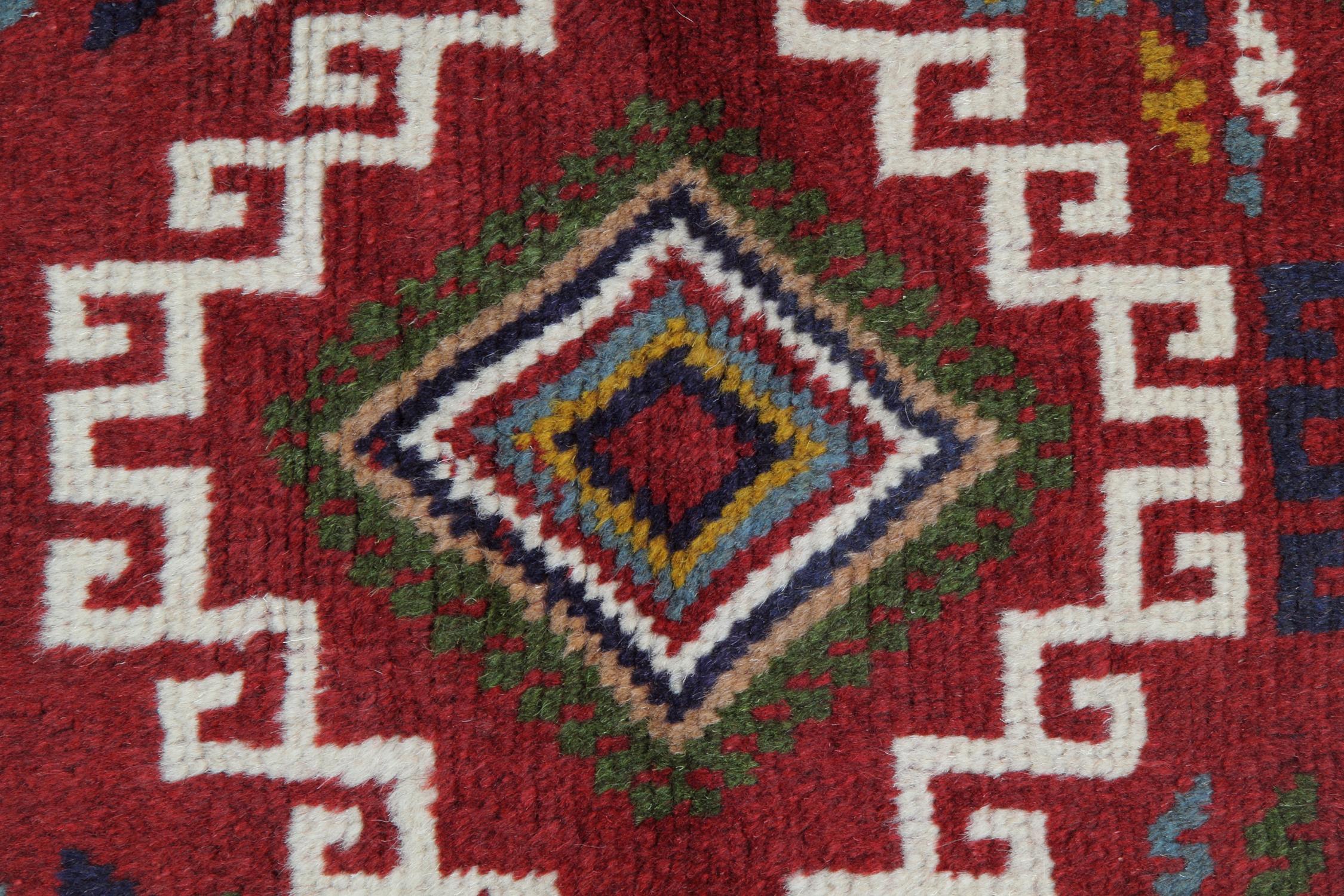Green, blue, white and grey make up the main accent colours of the medallions, woven on a rich red background with a decorative surrounding design and repeat pattern border. This elegant piece is sure to make the perfect accent rug in any home.