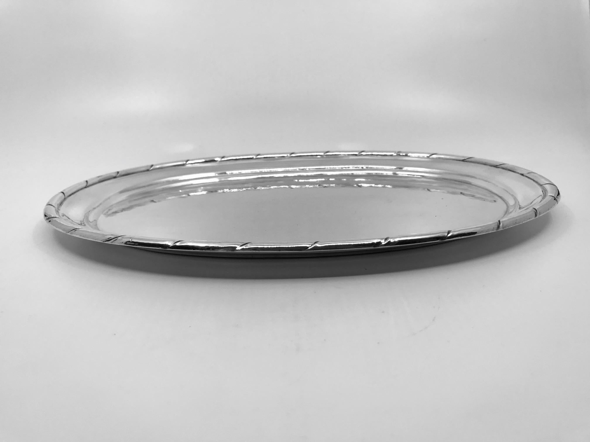 This is a sterling silver Georg Jensen hand-hammered tray with twist rim, design #88 by Georg Jensen.

Measures: 11 1/4? x 8 1/4? (28.2cm x 21.6cm).

Vintage Georg Jensen hallmark from 1915-1927.