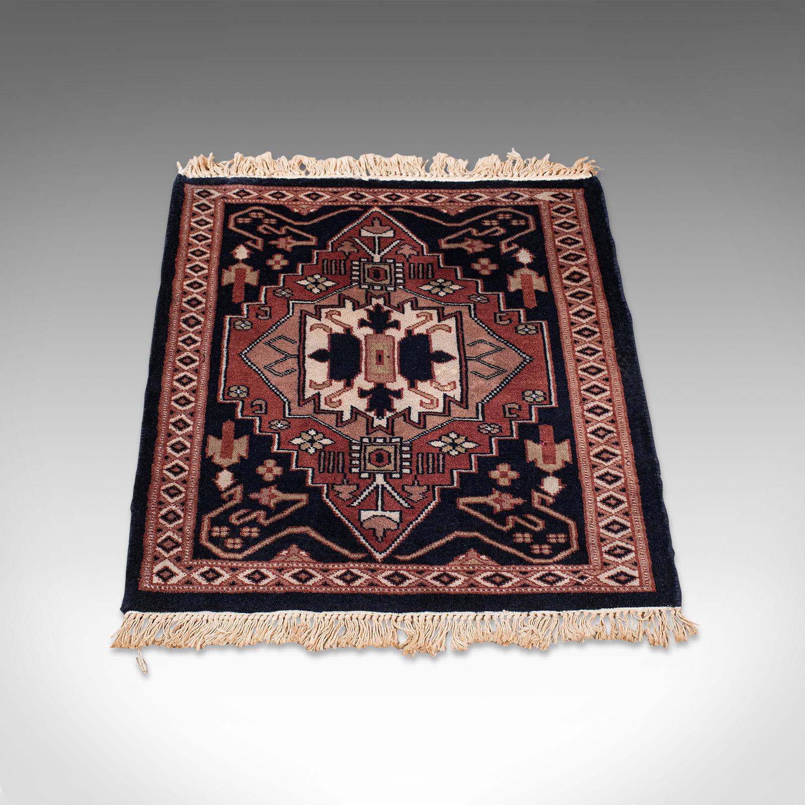 This is a small vintage hallway rug. A Persian, woollen reception hall or prayer mat, dating to the late 20th century, circa 1980.

Wonderfully contrasted palette of colors
Displays a desirable aged patina and in overall clean order
Dark blue