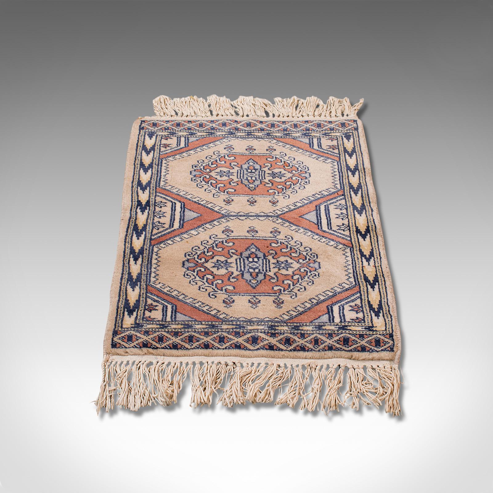 This is a small vintage Hamadan rug. A Persian, woolen hall or prayer mat, dating to the mid-20th century, circa 1950.

Pleasingly geometric small rug
Displays a desirable aged patina and in overall clean order
Signs of minimal wear under close
