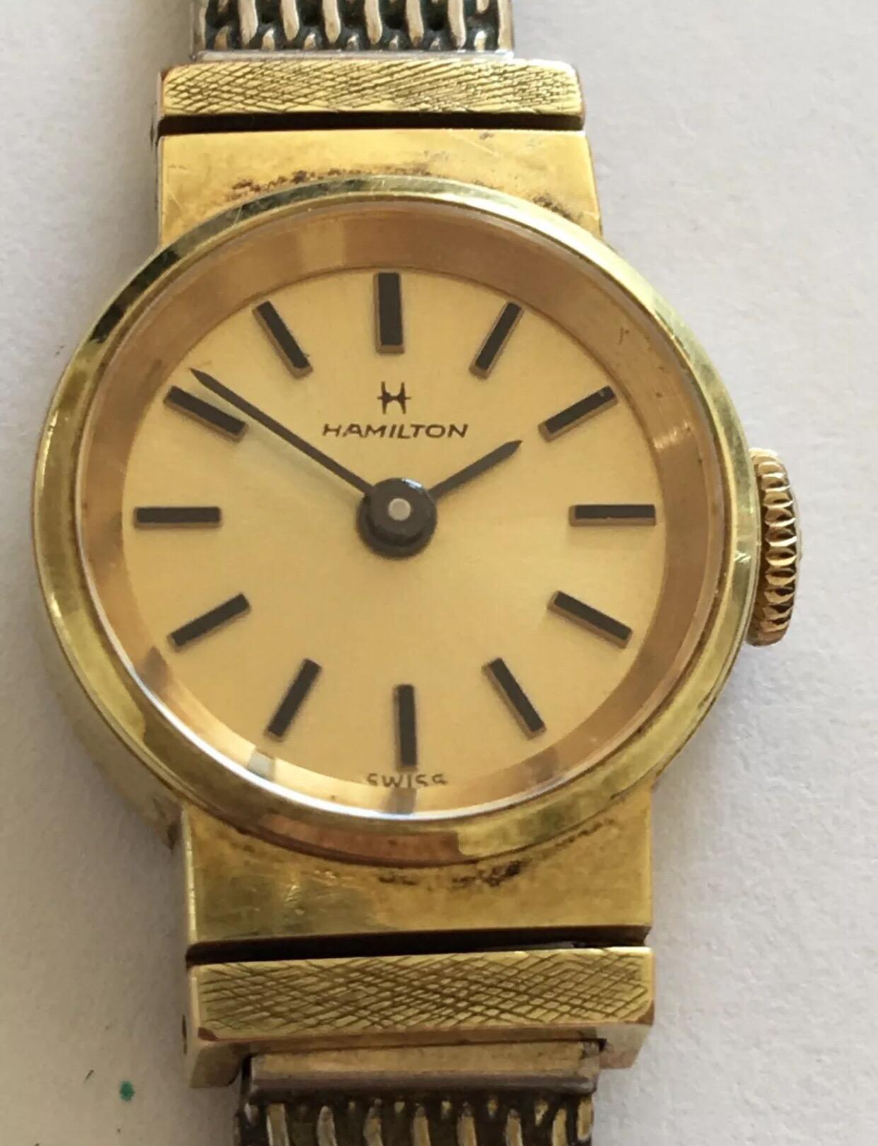 Vintage gold plated Hamilton Ladies Wristwatch.


This tiny beautiful mechanical watch is working and ticks well. Has some wear on the gold plated metal strap.