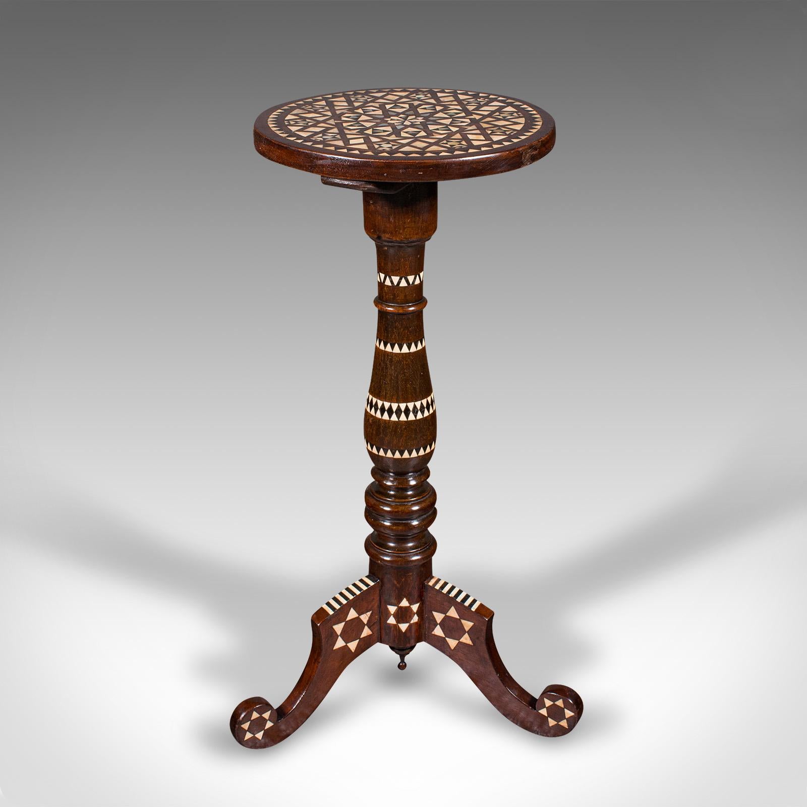 
This is a small vintage hookah table. A Middle Eastern, mahogany side table inlaid with bone and Mother of Pearl in the Moorish taste, dating to the mid 20th century, circa 1950.

Wonderful eastern appeal with an eye-catching finish and petite