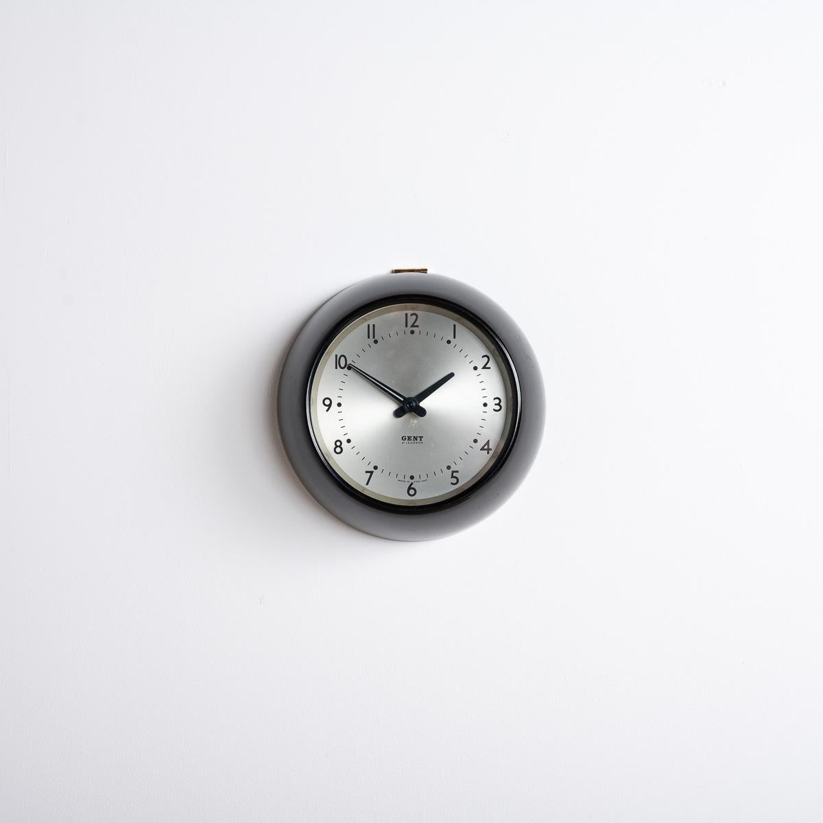 Gent of Leicester 6 inch Bakelite Slave Clock with Silver Dial.

A small bakelite wall clock by renowned British clock maker Gents of Leicester.

Made in England circa 1950.

Gent of Leicester makers marks to the silver dial with their tapered