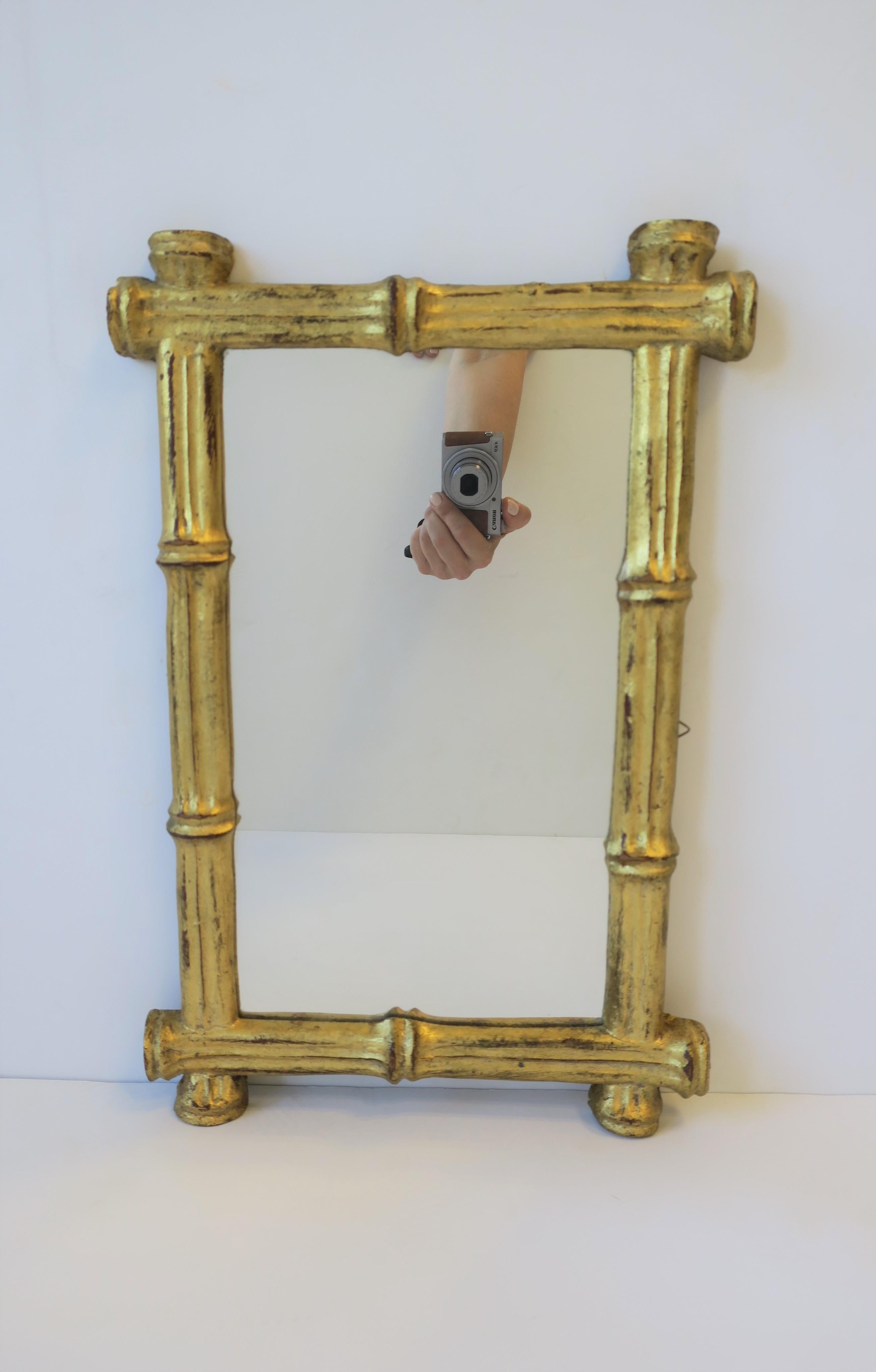 A beautiful small Mid-20th century Italian mirror with a gold giltwood frame in a 'bamboo' style, circa 1960s, Italy. 

Mirror can hand vertically or horizontally. With maker's mark on back and marked 