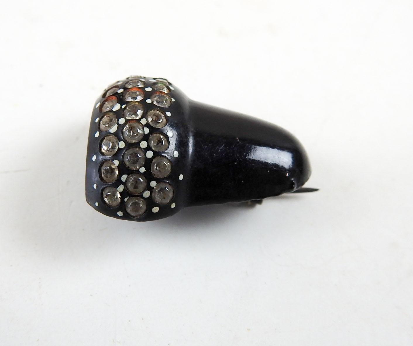 Small vintage circa 1950's black lacquer and rhinestone acorn pin. Unsigned, pin and hook finding, good condition.