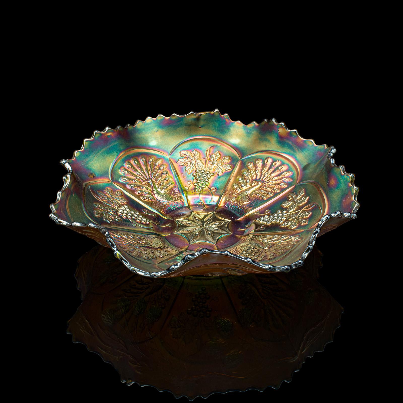 
This is a small vintage lustre dish. A Continental, art glass decorative fruit bowl, dating to the late 20th century, circa 1970.

Radiant colour and serpentine form catches the eye
Displays a desirable aged patina and in good order
Green glass