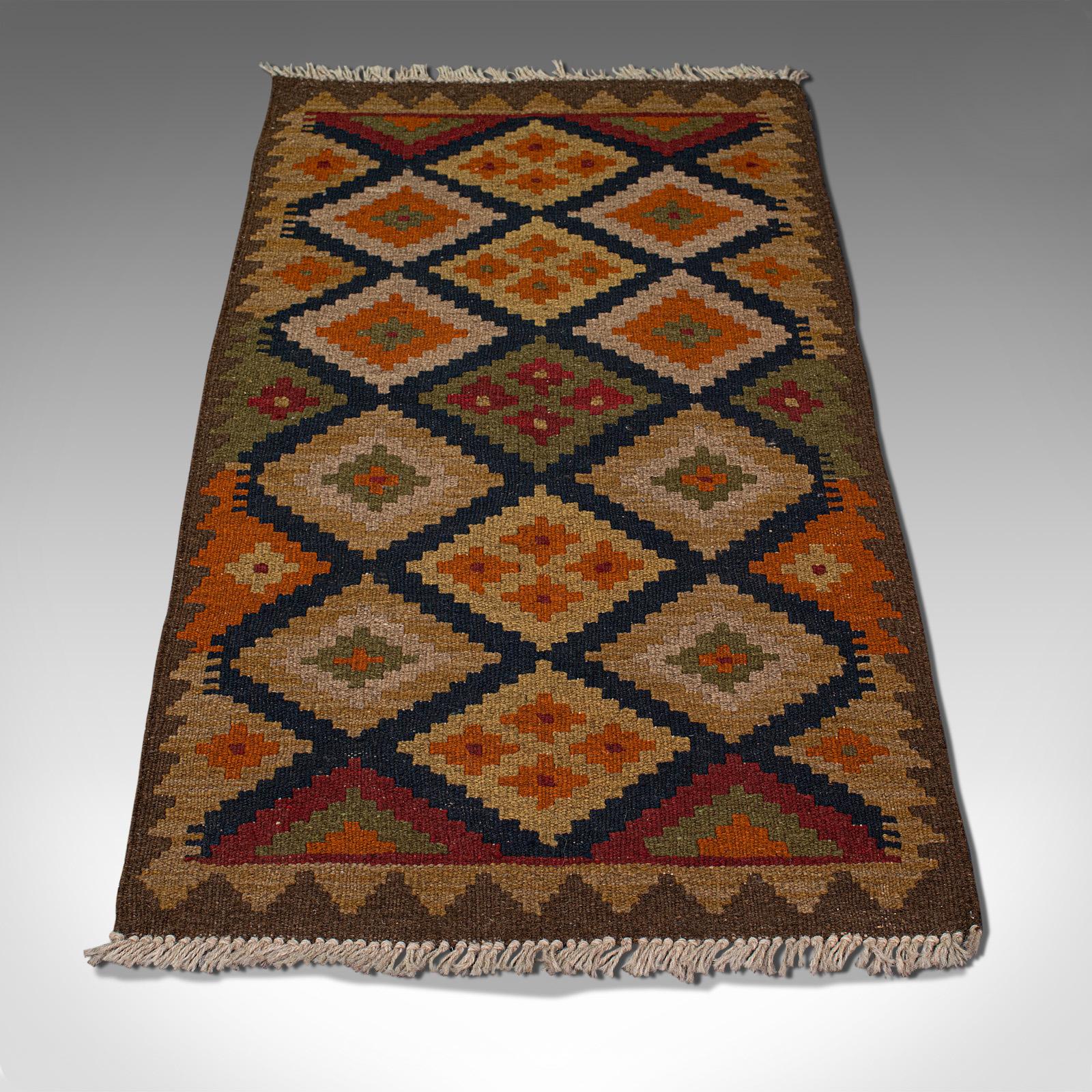 This is a small vintage Maimana Kilim rug. A Middle Eastern, woven prayer mat, dating to the mid 20th century, circa 1960.

Of prayer mat or doorway size at 56cm (22'') x 104.5cm (41.25'')
Displaying a desirable aged patina
Woven without pile,