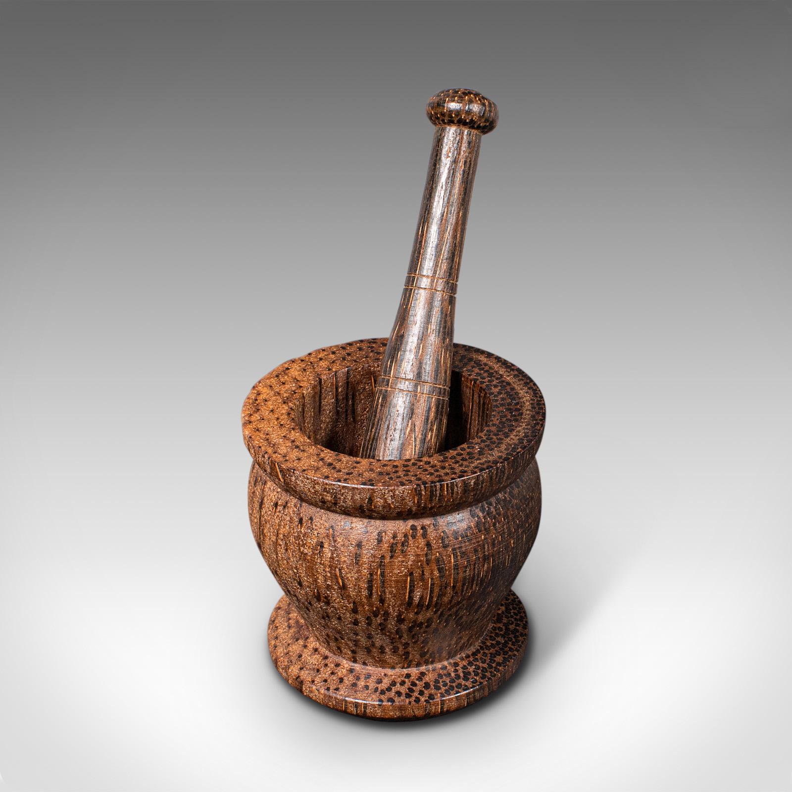 This is a small vintage mortar and pestle. An English, Black Palmyra decorative treen or apothecary set, dating to the mid 20th century, circa 1960.

Diminutive and delightful, ideal for display or use
Displaying a desirable aged patina and in