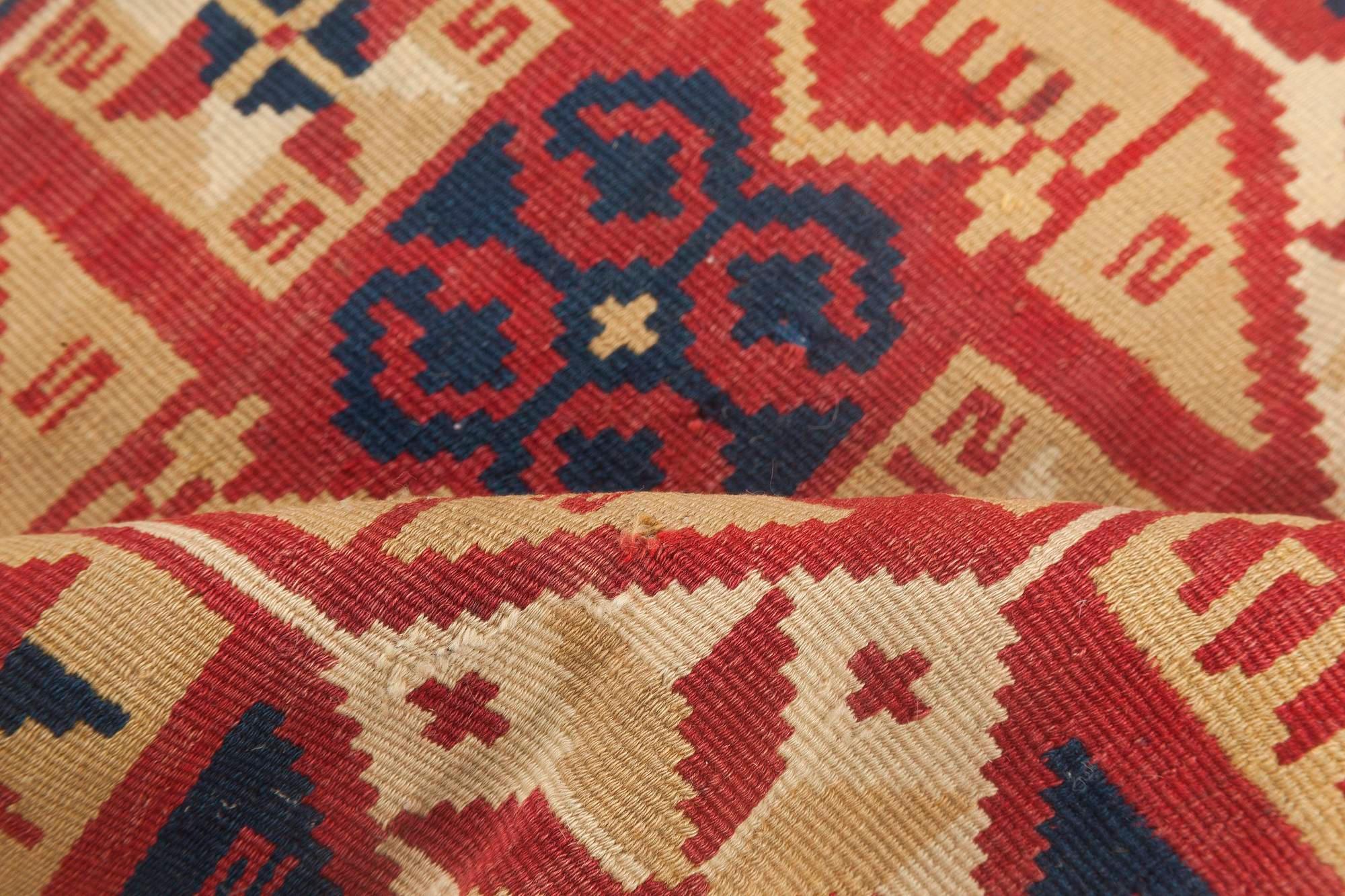 Small vintage geometric red, blue Swedish flat-weave wool rug
Size: 1'10