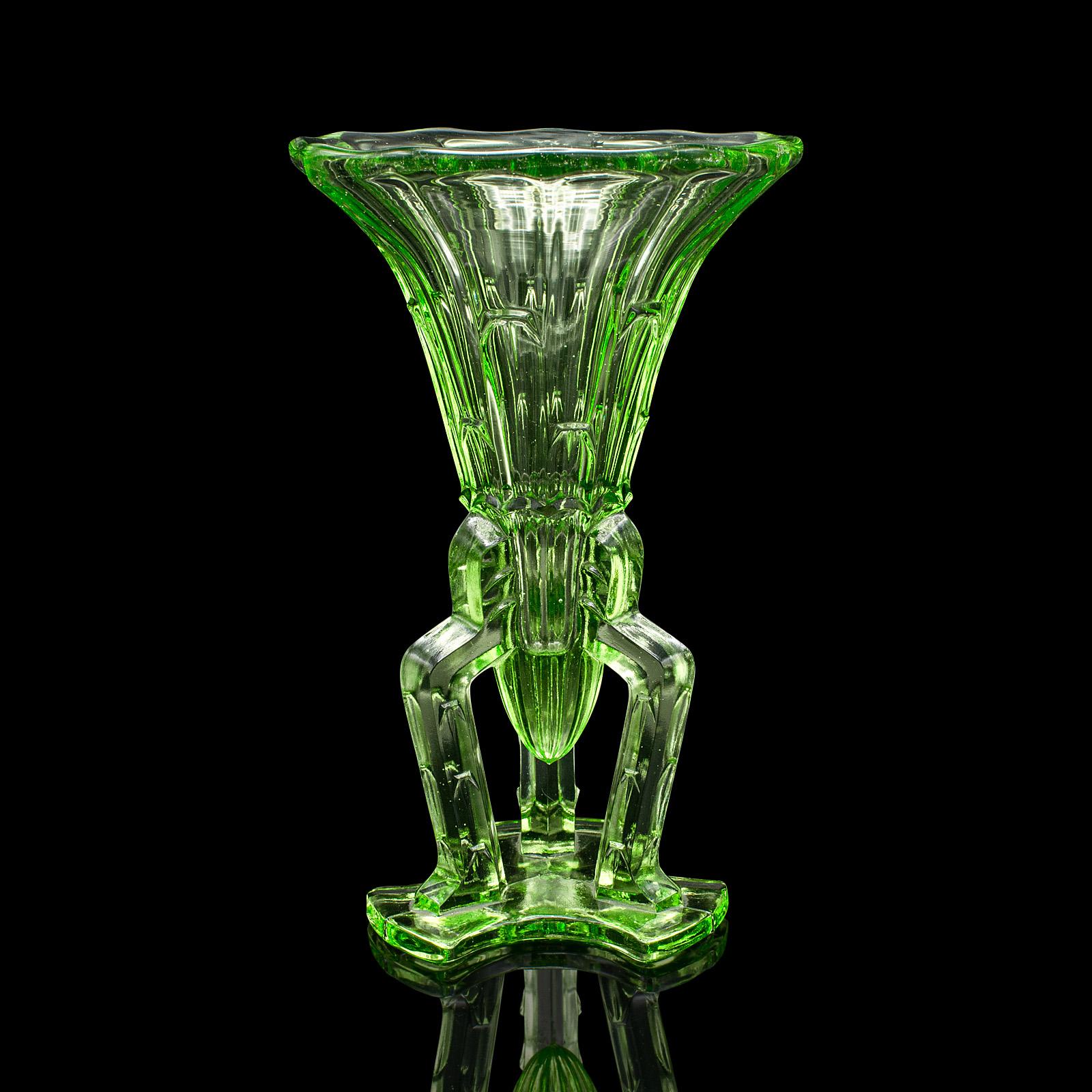 
This is a vintage rocket vase. An English, art glass posy vase, dating to the Art Deco period, circa 1930.

Appealingly decorative rocket vase with great colour
Displays a desirable aged patina and in good order
Green glass presents a vibrant