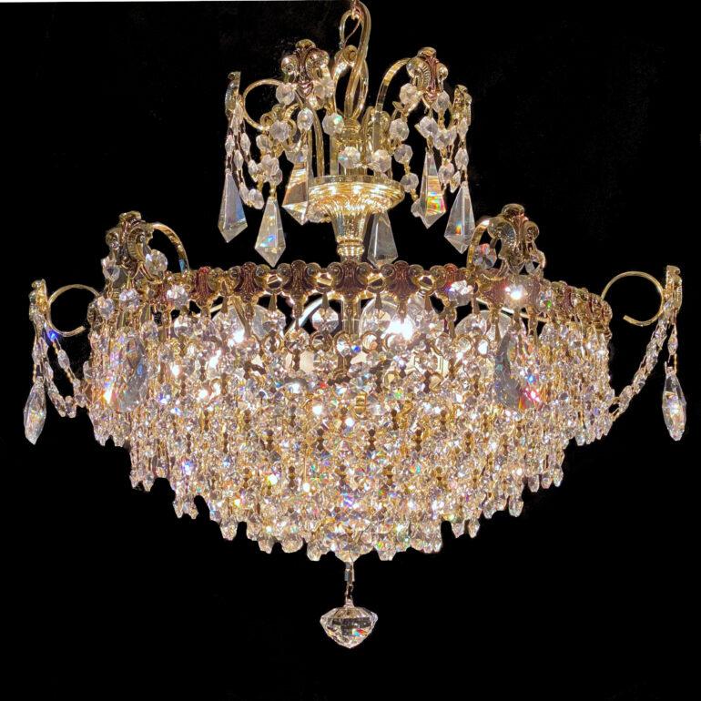 Small Vintage Schonbek Crystal chandelier. Loaded with swarovski crystals in a brass finish.