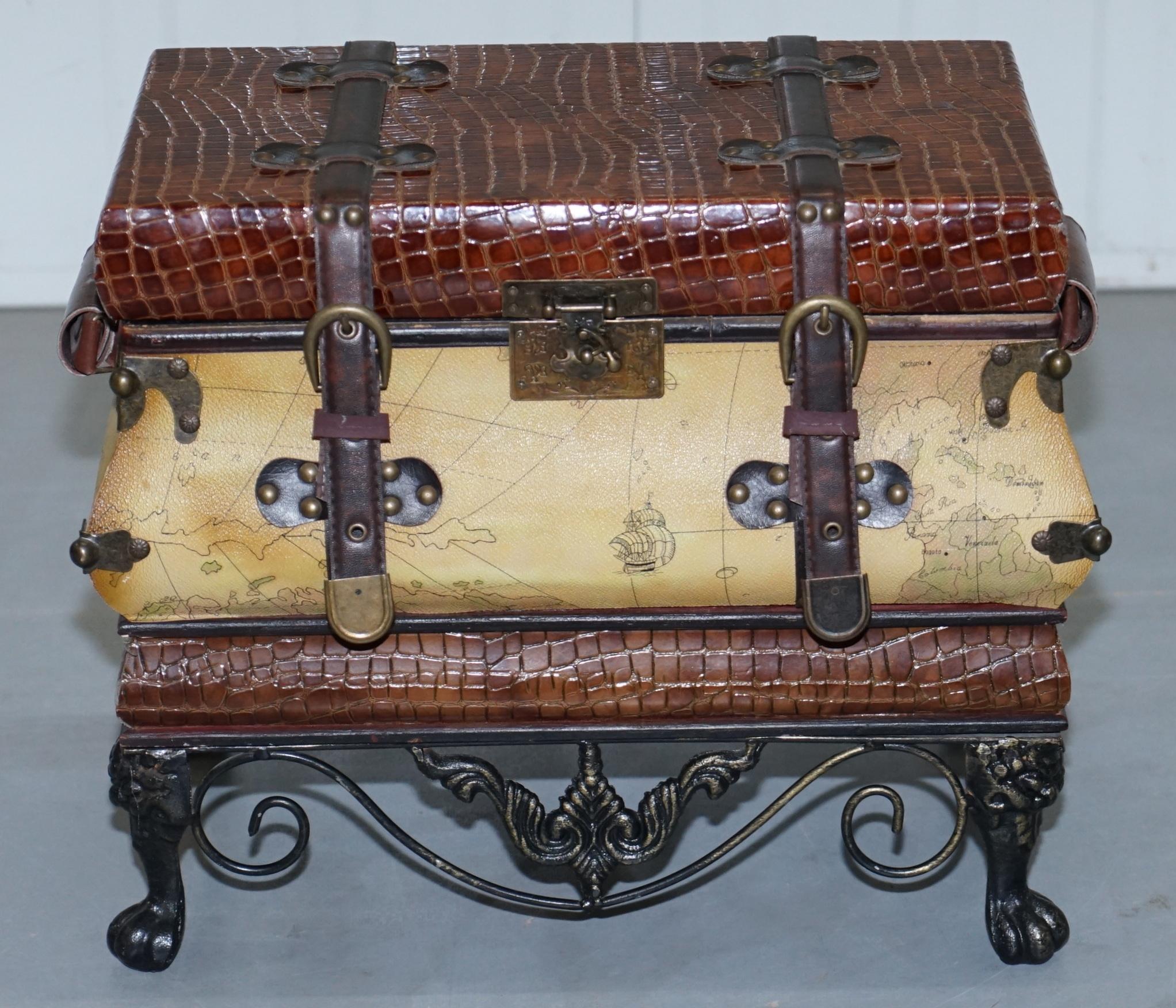 We are delighted to offer for sale this lovely little luggage trunk chest with leather straps, wrought iron base and map detailing

A sweet piece of furniture, the top opens up and it can be used for storage, the size is table top or floor based,