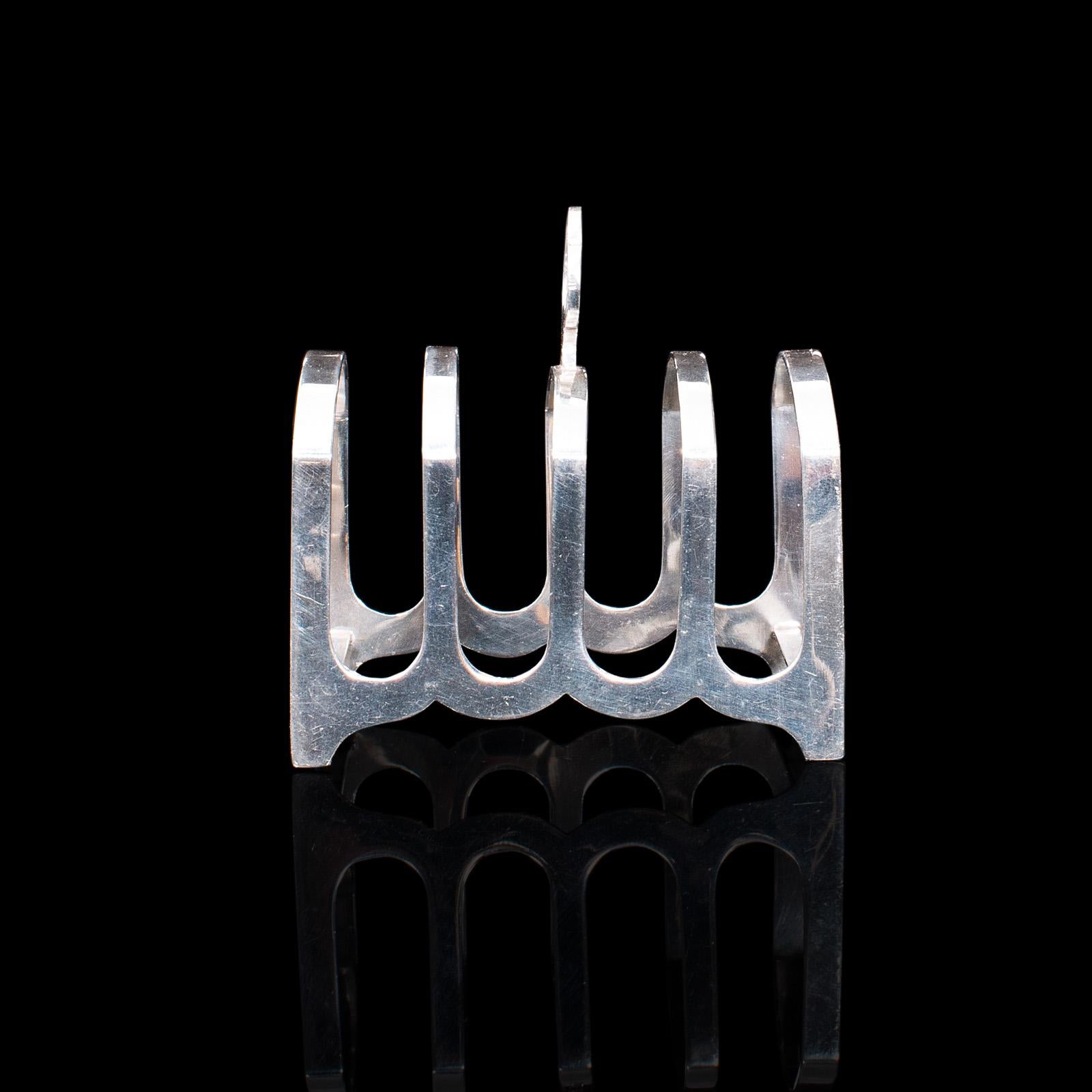This is a small vintage toast rack. An English, silver, hallmarked breakfast holder, dating to the mid 20th century, 1938.

Appealing, hallmarked silver toast rack
Displays a desirable aged patina throughout
Silver in good order, with bright