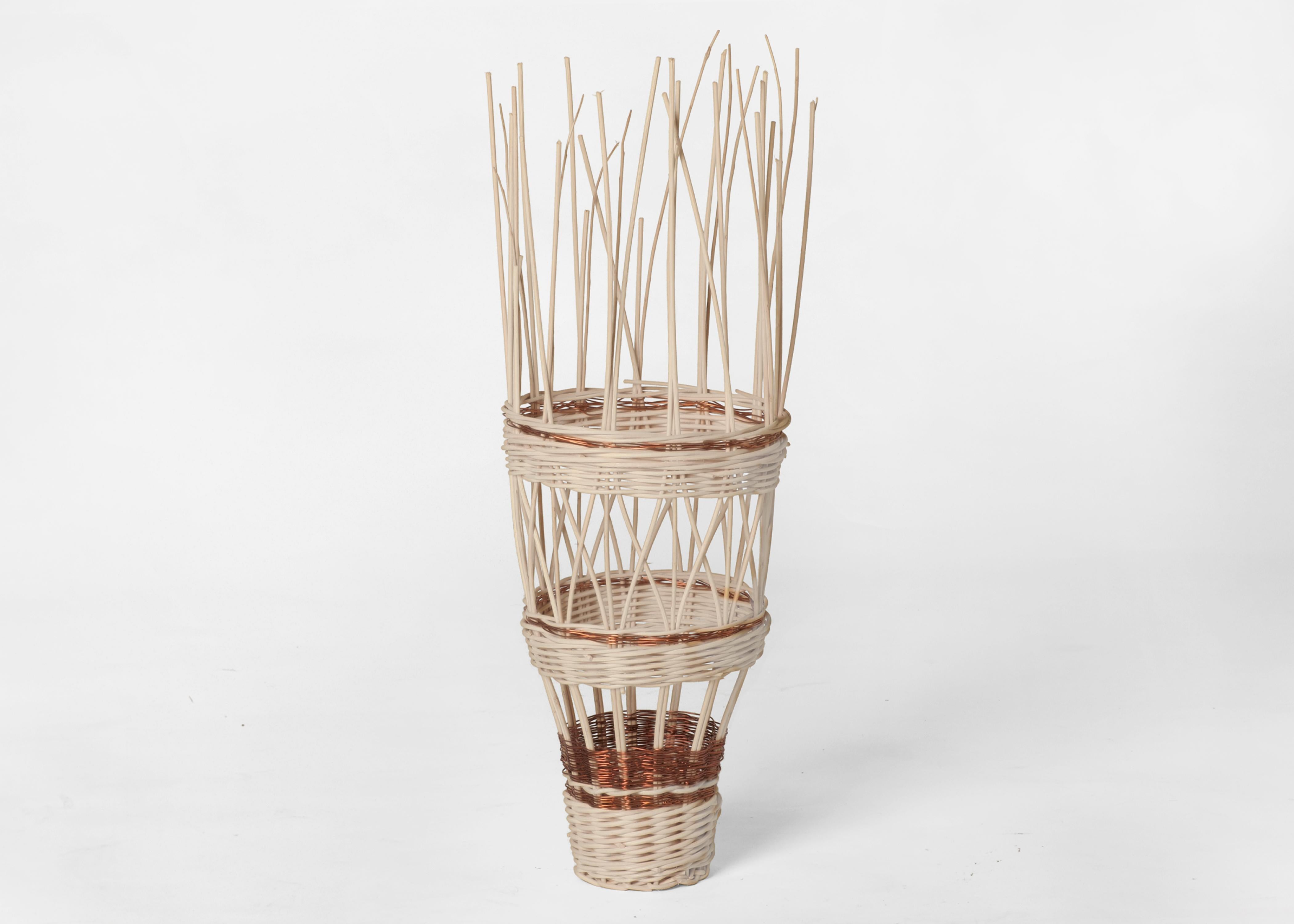 Small voodoo basket by Edizione Limitata
Limited Edition. Signed and numbered.
Designers: Simone Fanciullacci
Dimensions: H 55× W 18× L 18 cm
Materials: Handwoven rattan, copper wire

Edizione Limitata, that is to say “Limited Edition”, is a brand