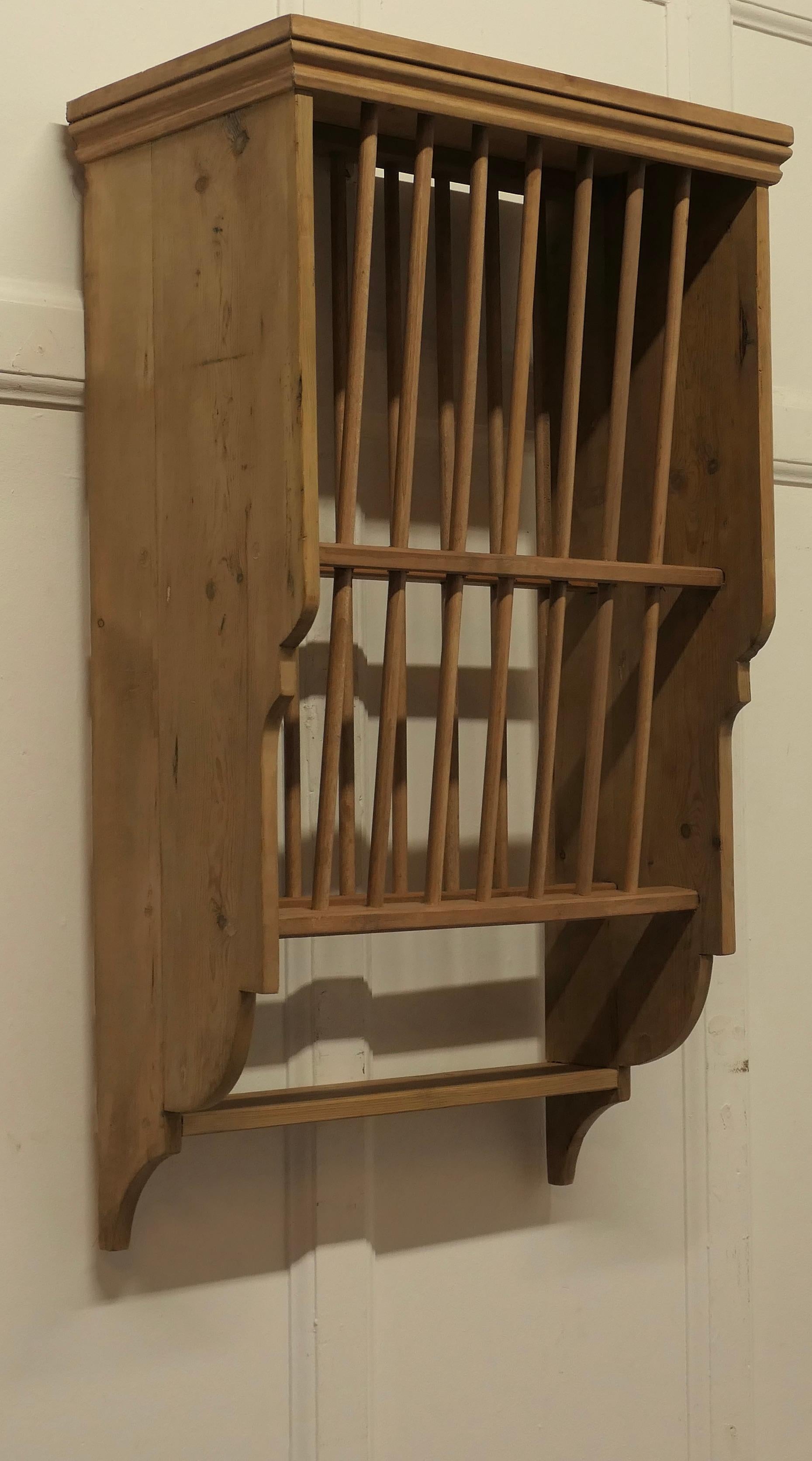 Small Wall Hanging Pine Plate Rack


This useful piece hangs on the wall and drains and stores plates until required
It has a pine frame and wooden dowels with a waterfall shape, allowing 2 rows of plates to be stored at any one time, below there is