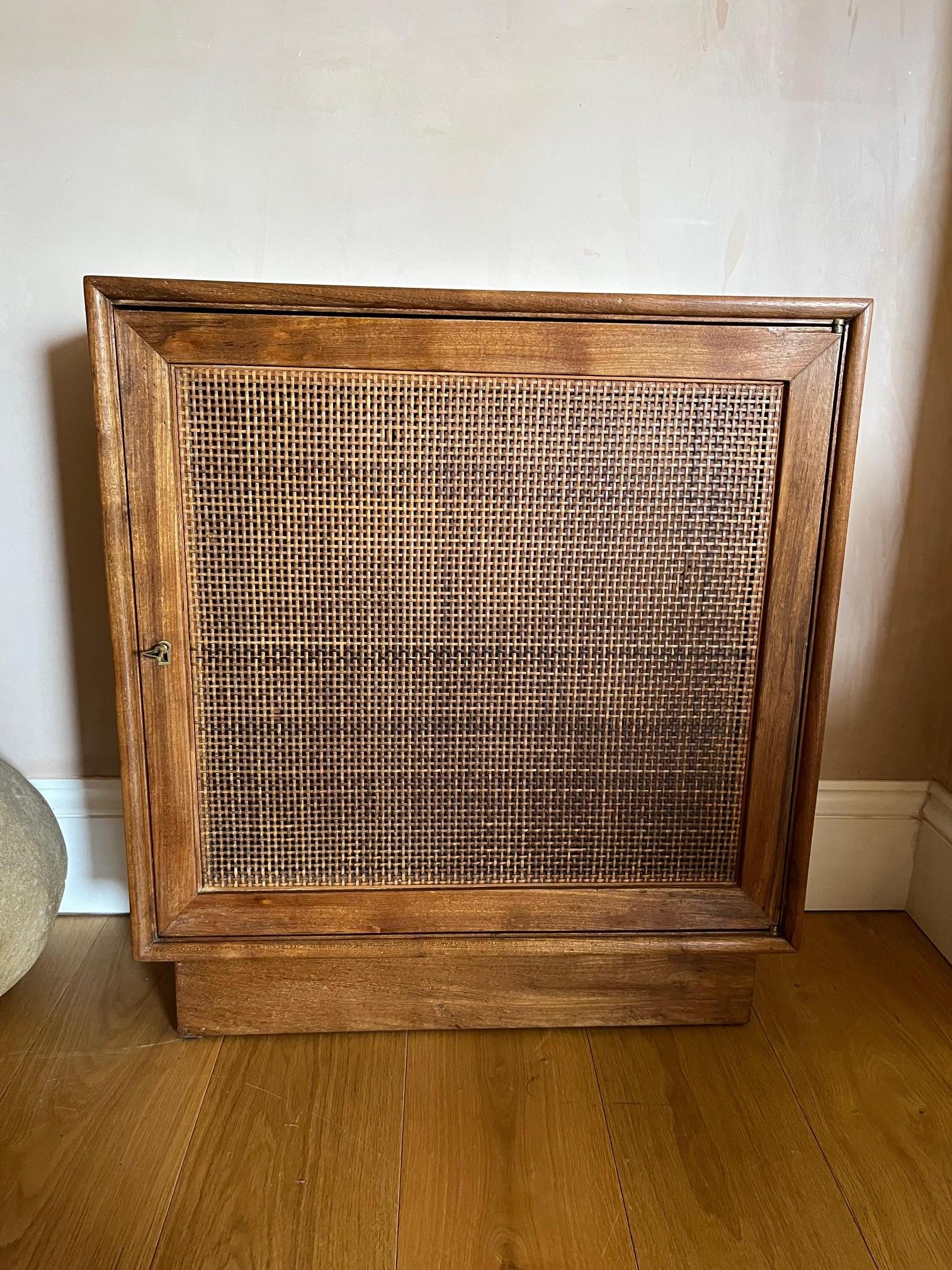 This cabinet is small and would possibly have had a stick stand to one side, as there are filled in holes where this would have been attached. More than likely to have been a one off commission for a hall way. The wood is in good condition with just