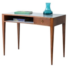 Small walnut centerpiece desk in the Ponti style with a curved front