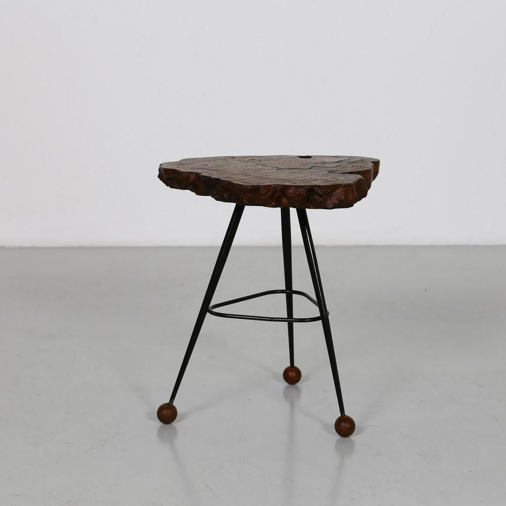 This charming, small slab table with its radical edge, spherical feet and bent steel painted frame is as great looking as it is practical. While sturdy, it is also lightweight and can be easily moved to accommodate extemporaneous needs, such as for