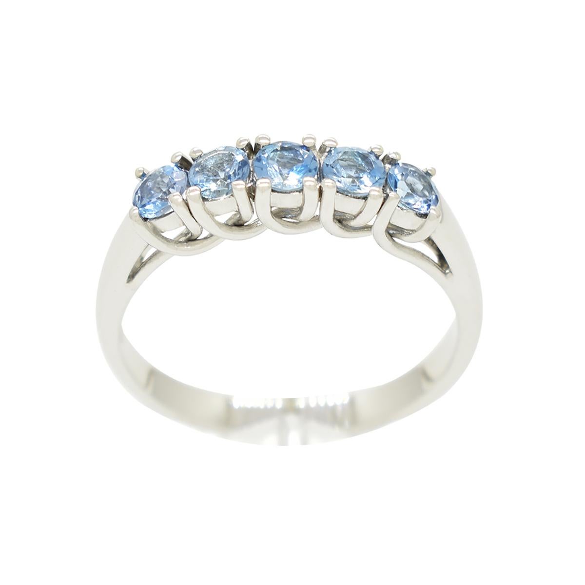 This is a wonderful aquamarine ring with a beautiful selection of 5 round cut natural aquamarines with a stunning medium blue color, excellent clarity and fantastic brightness, which makes them exceptional quality gemstones. The entire ring is