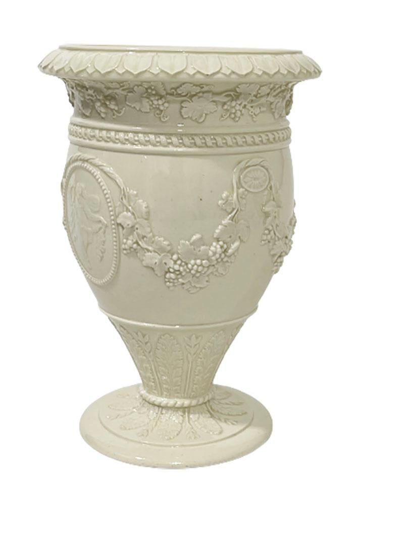 Small Wedgwood creamware vase, England

Small Wedgwood creamware vase with in pearl medallion the goddess Demeter (Ceres) adorned with garlands of the grape vine and at the base surrounded by the corn and grain in a rope and gadroon pattern

Marked