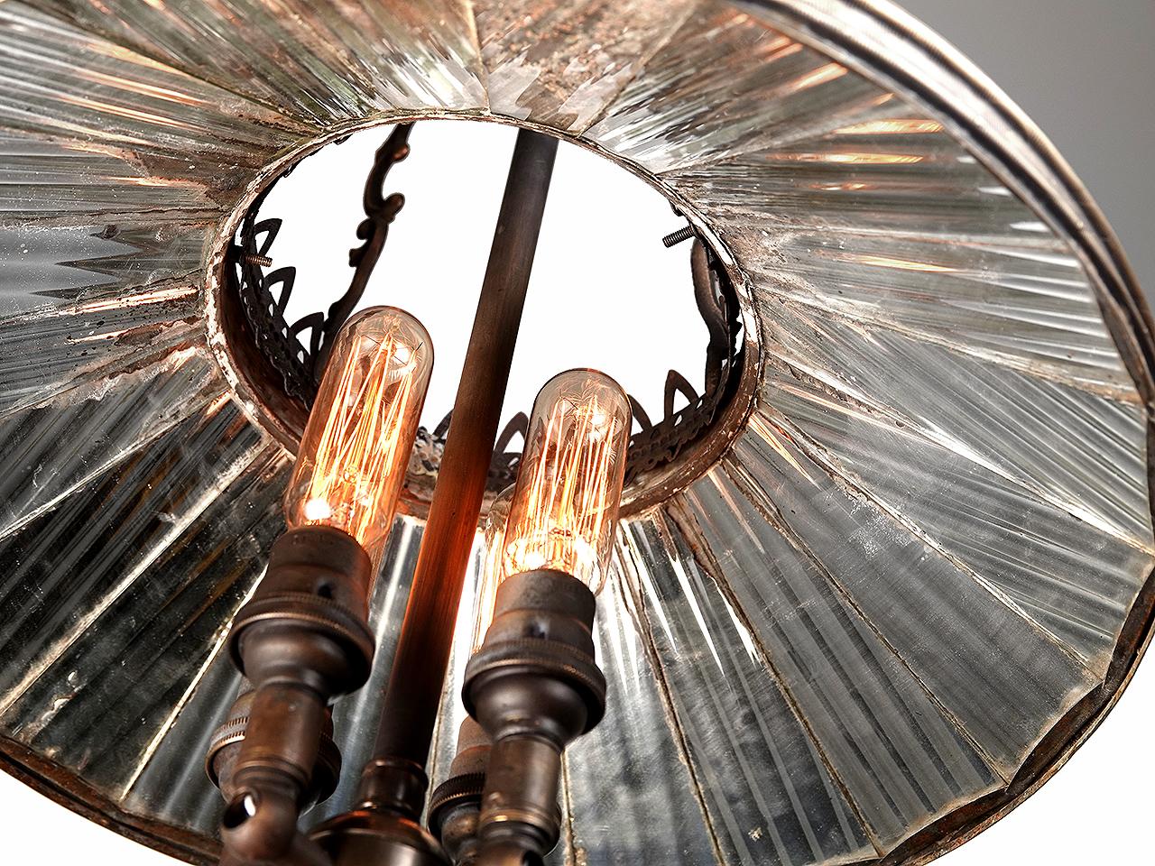 I'm always on the look out for these turn of the century mirrored lamps. They are the Holy Grail of industrial lighting. Collectors love them and they are very hard to find. This is a nice decorative example with a lot of detail.
Originally gas...