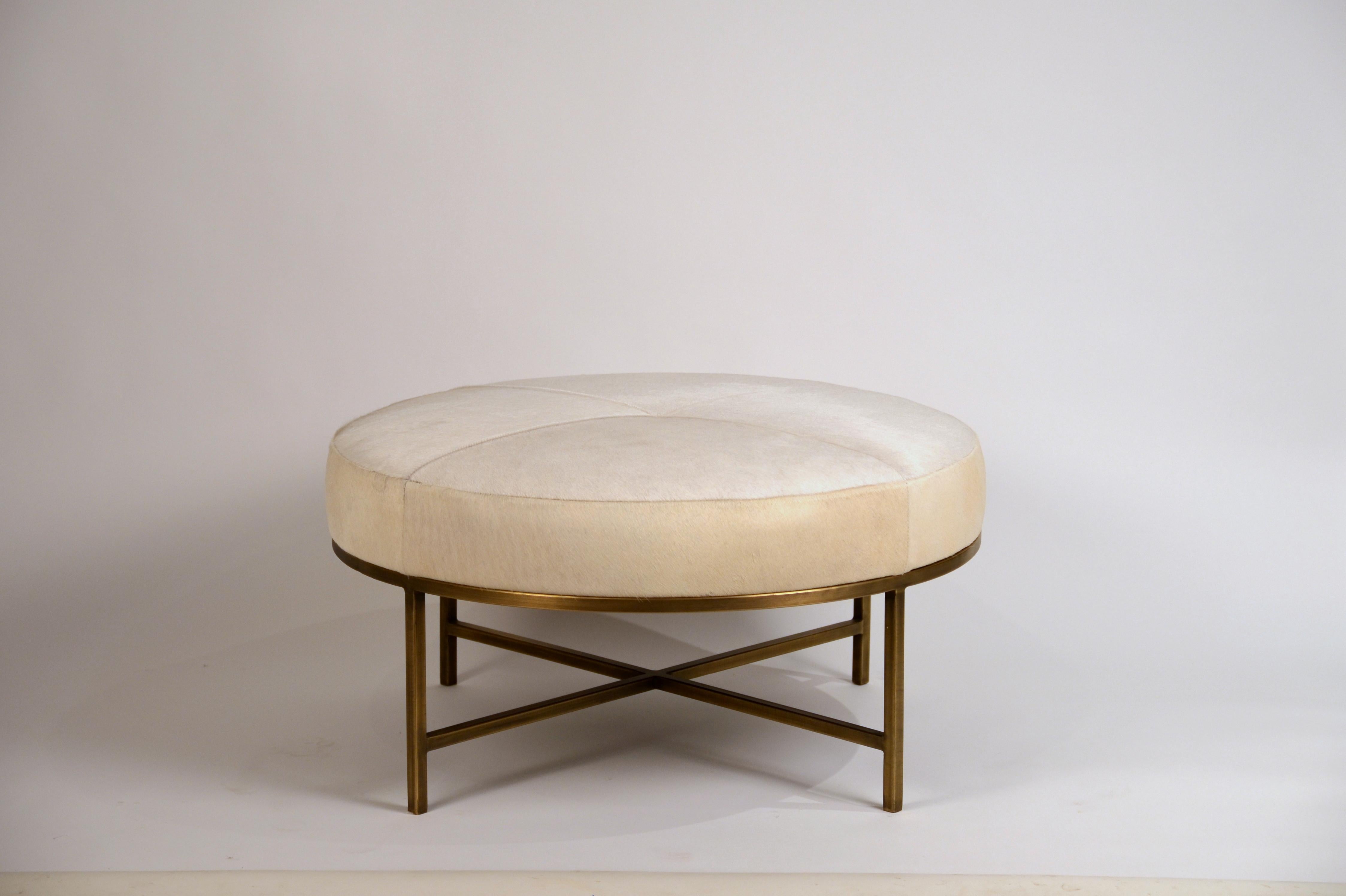 Small white hide and patinated brass 'Tambour' ottoman by Design Frères.

Perfect as a coffee table in the living room, a den or a media room.

Brass-plated and patinated steel base with handstitched natural white cream or ivory or white hide
