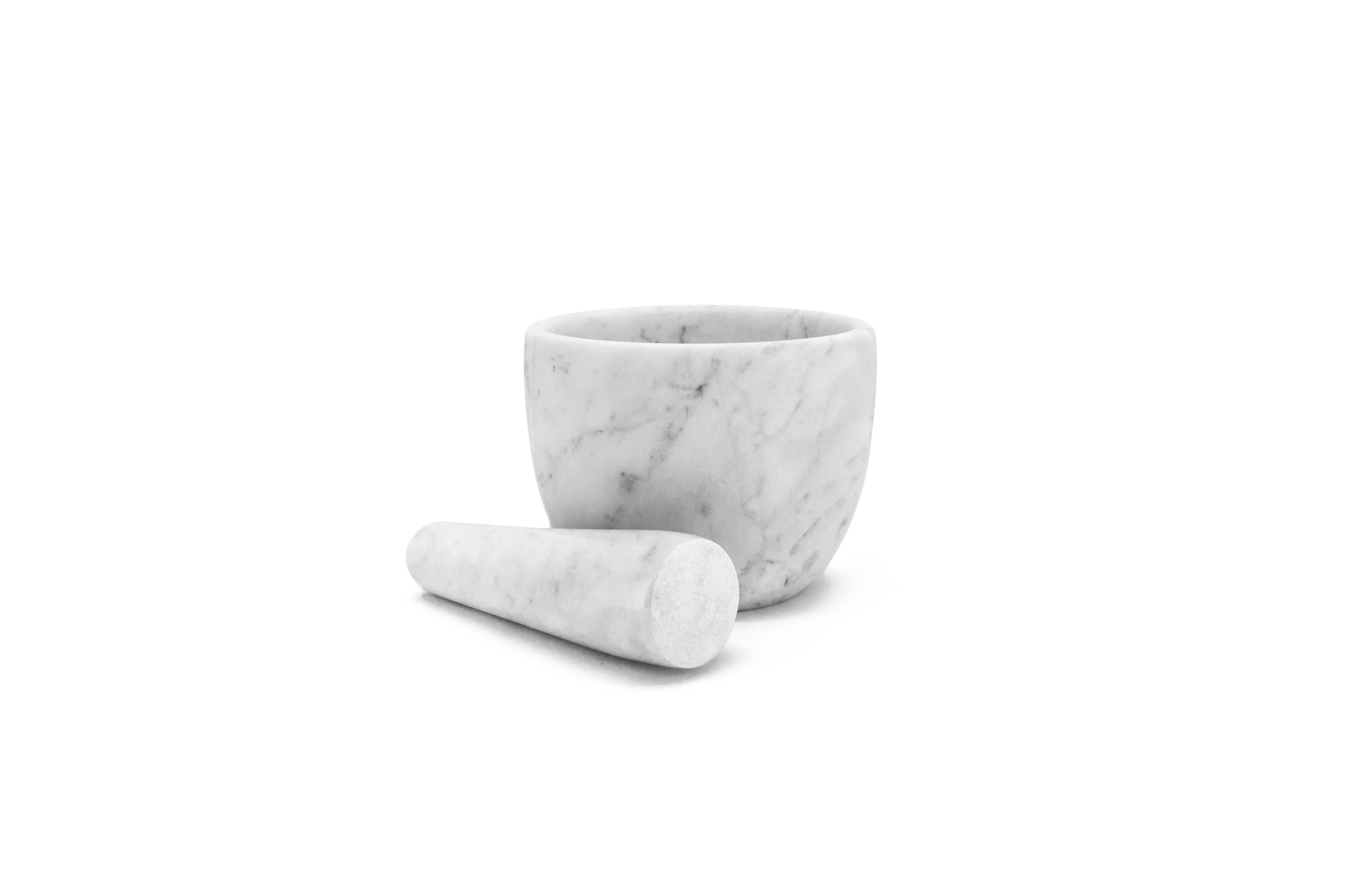 Small white Carrara marble mortar and pestle. 

Size of the mortar: diameter 12 cm x height 9; size pf the pestle: diameter 3.5 cm x 12.5 cm length.

The product cannot be washed in dishwasher but needs to be cleaned with water or Marseille