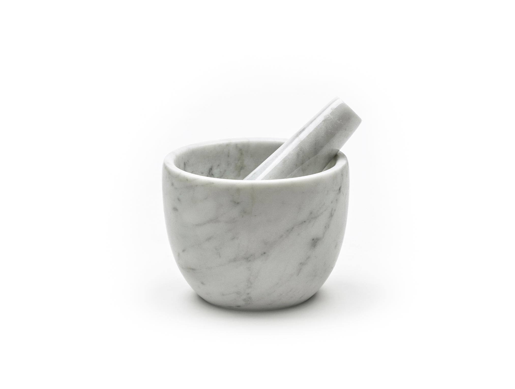 white marble mortar and pestle