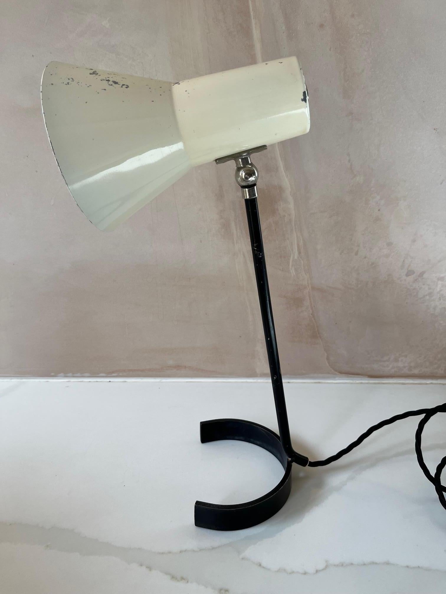 Small white and black iron desk lamp. 