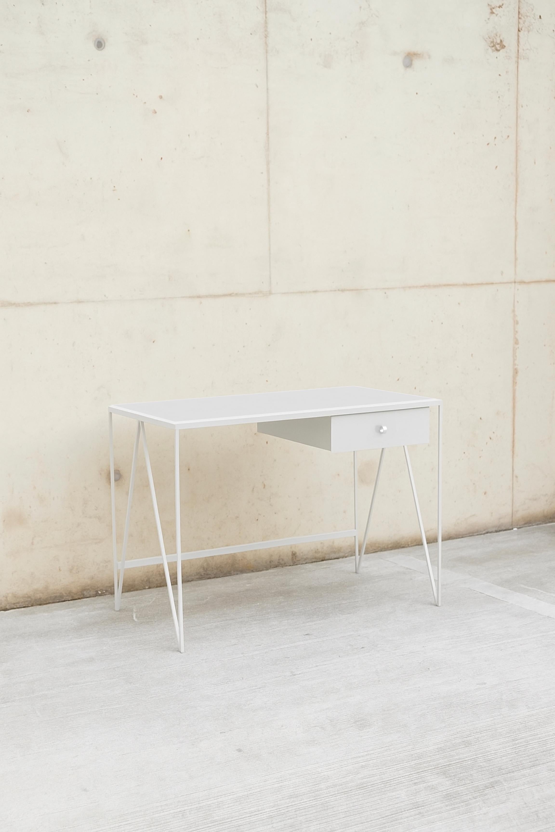 This small study desk is made with a paper white powder-coated steel frame and a off white colour matched natural linoleum tabletop. The linoleum for our desks is selected for the ecological properties of the linseed of which it is made. It also has