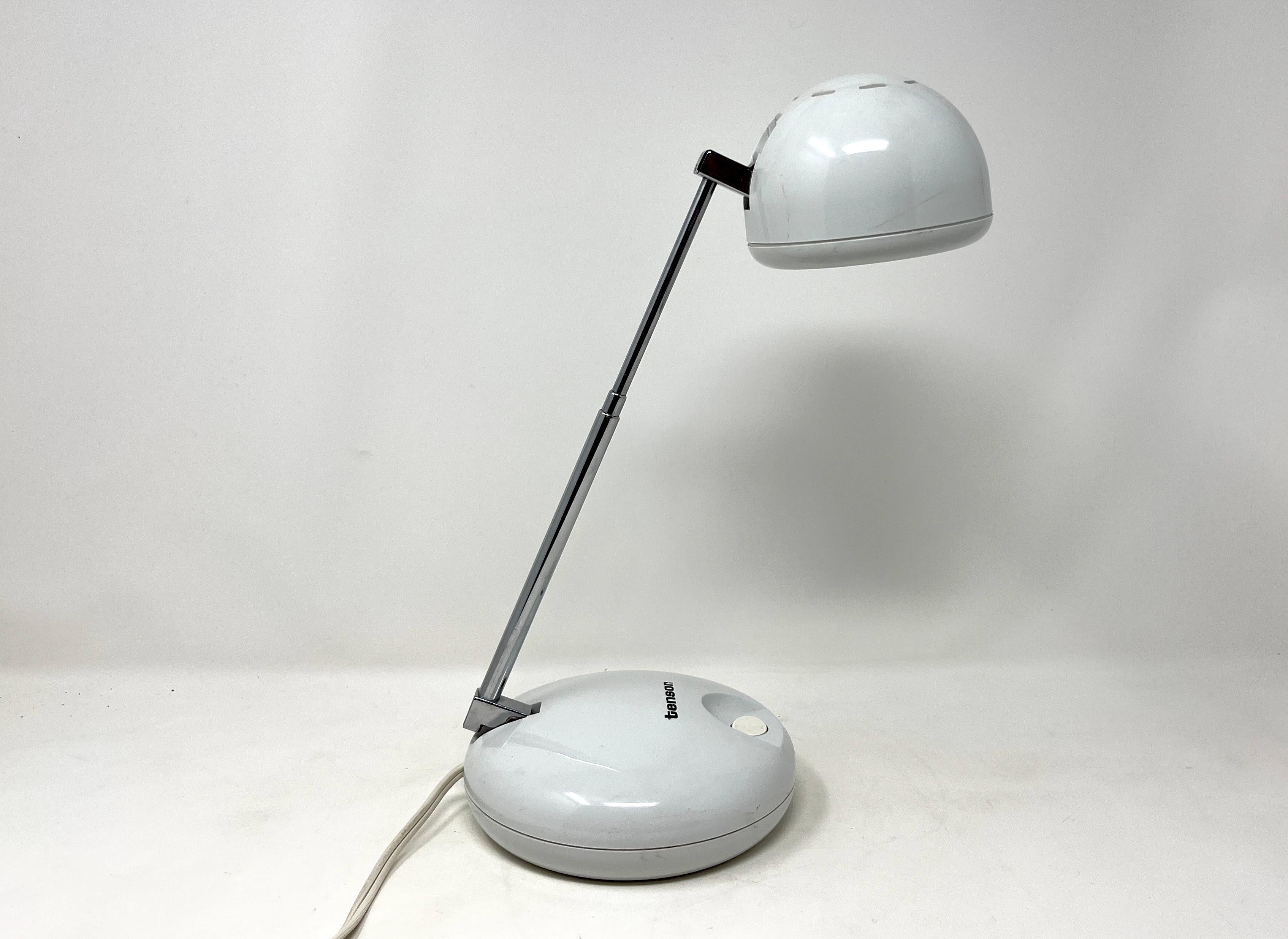 Quintessential post-modern 1990s white Tensor desk lamp with high-gloss hard plastic base and shade, and stainless steel neck. It has three set heights (or lengths) extending between 9
