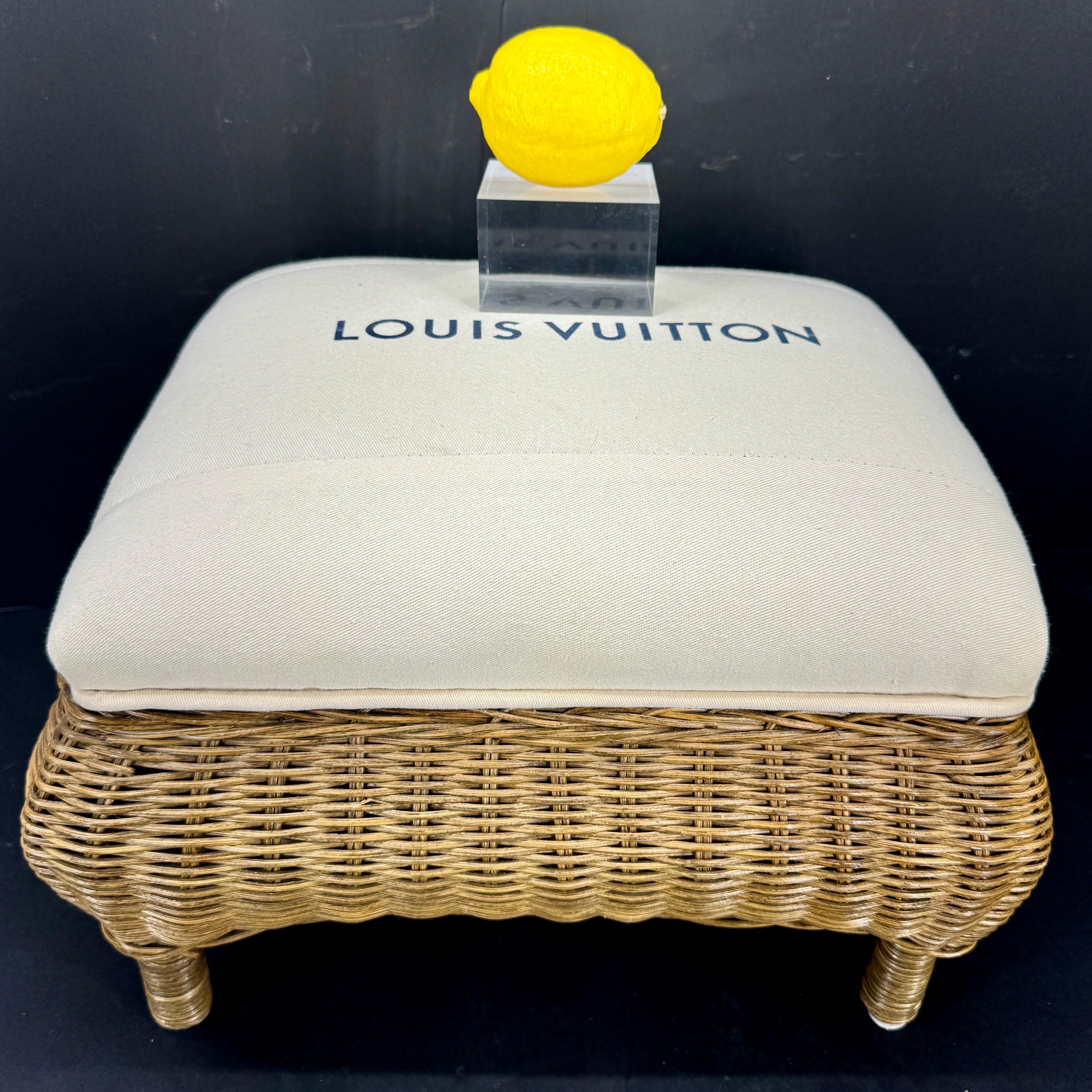 Design and purpose best describe this one-of-a-kind stool. This small Eero Aarnio style bench features authentic classic Louis Vuitton fabric seats atop a very sturdy wicker base. This piece was well thought out and then executed by a professional