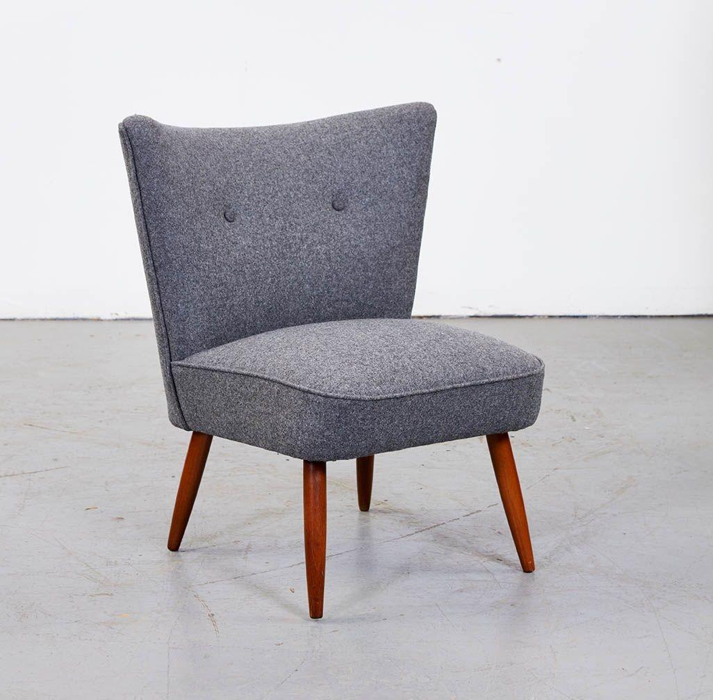 A small modern upholstered chair in the mobler style having jaunty winged back over a deep seat and standing on turned splayed beech legs.  Newly upholstered in a top-quality Scottish haberdashery wool incorporating two tufted buttons on the back. 