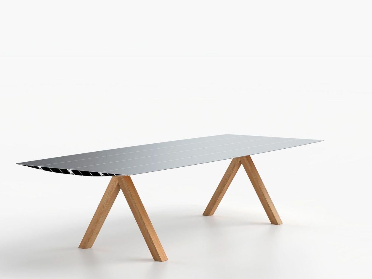 Small wood table B by Konstantin Grcic
Dimensions: D 120 x W 240 x H 74 cm 
Materials: Tabletop in extrusioned aluminium with open ends cut at 45º. There is the option of the surface being laminated in a natural oak effect with a varnished finish.
