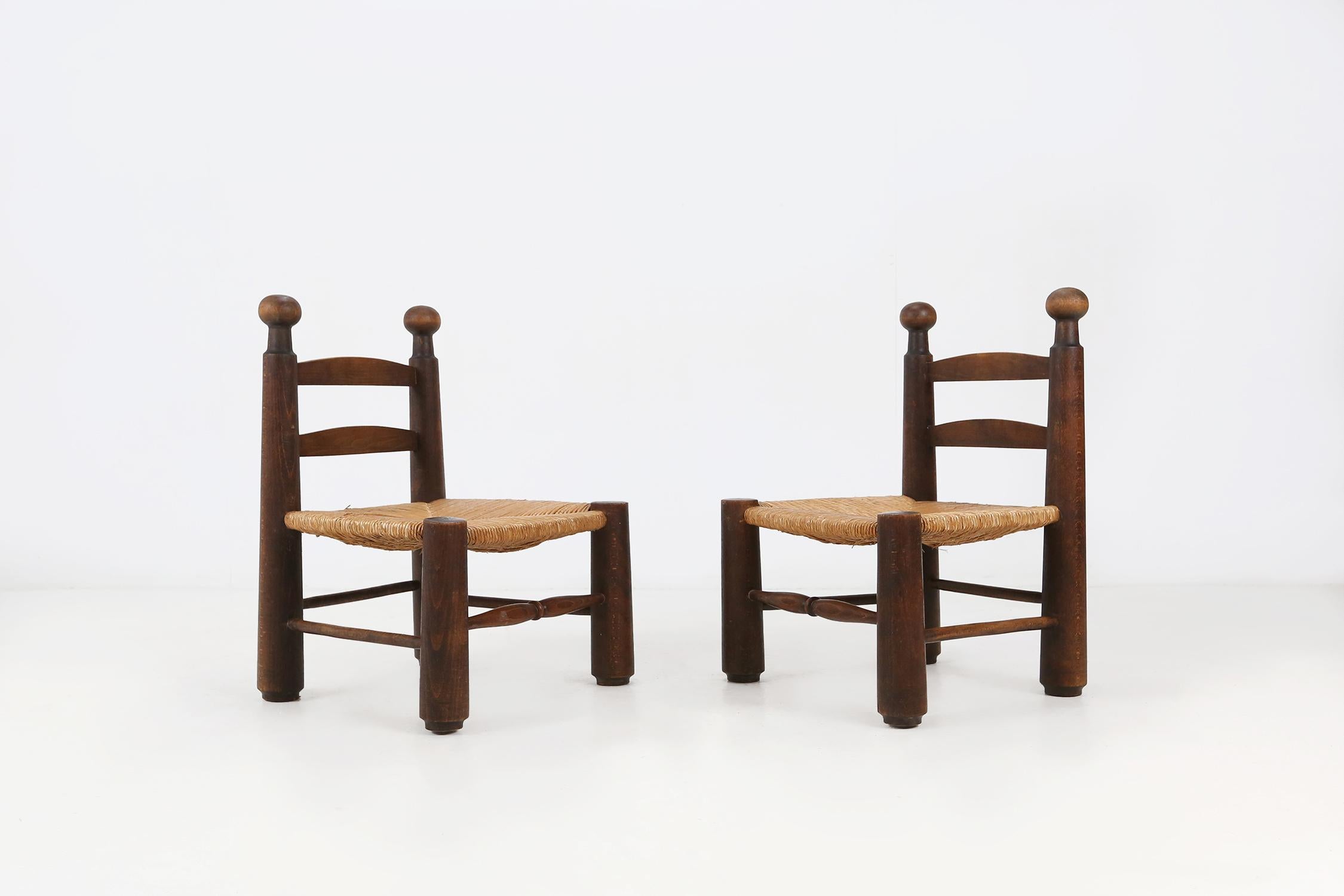 Set of two low side chairs by French designer Charles Dudouyt, 1940's.
Made of solid wood an wicker seat.