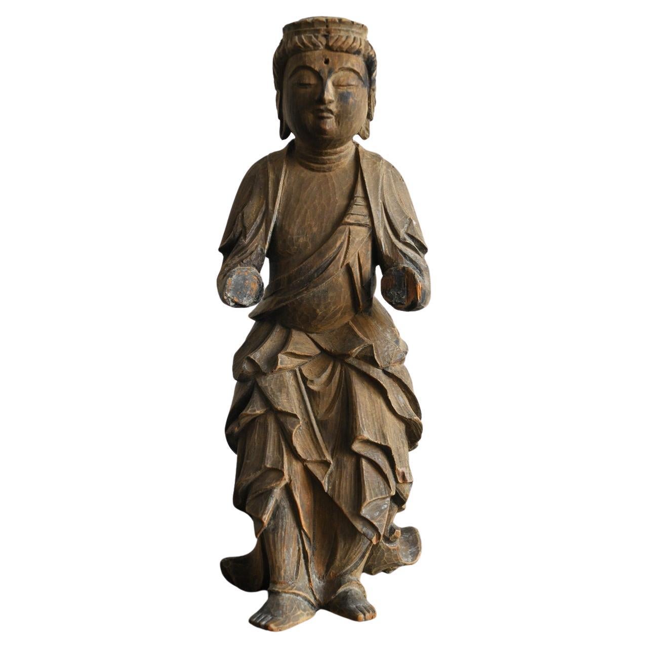 Small wooden Buddha statue from the Edo period in Japan/17th to 19th century