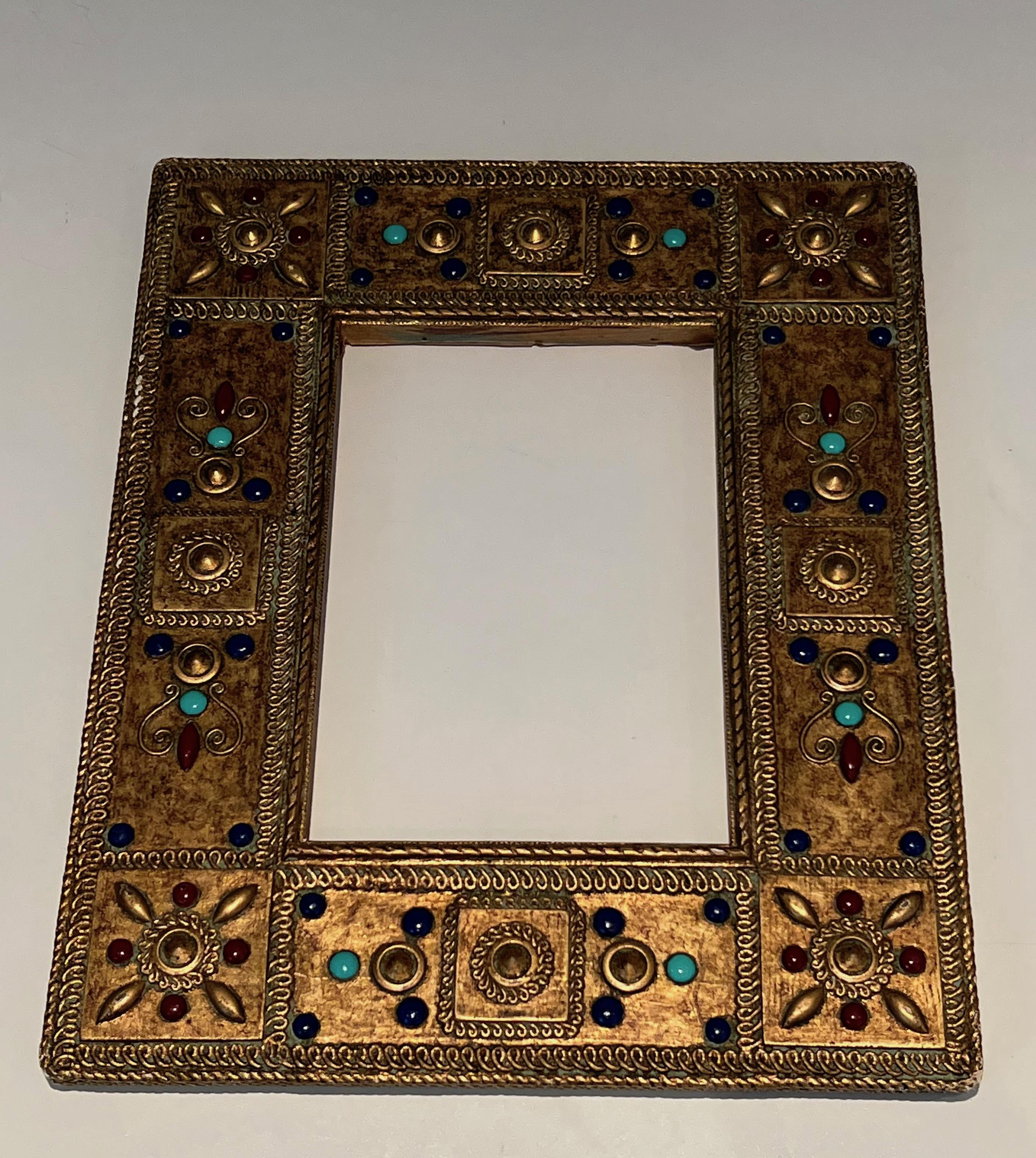 This small rectangular frame is made of a very fine carved wood with semi-precious stones incrustations. This is a French work. Circa 1970