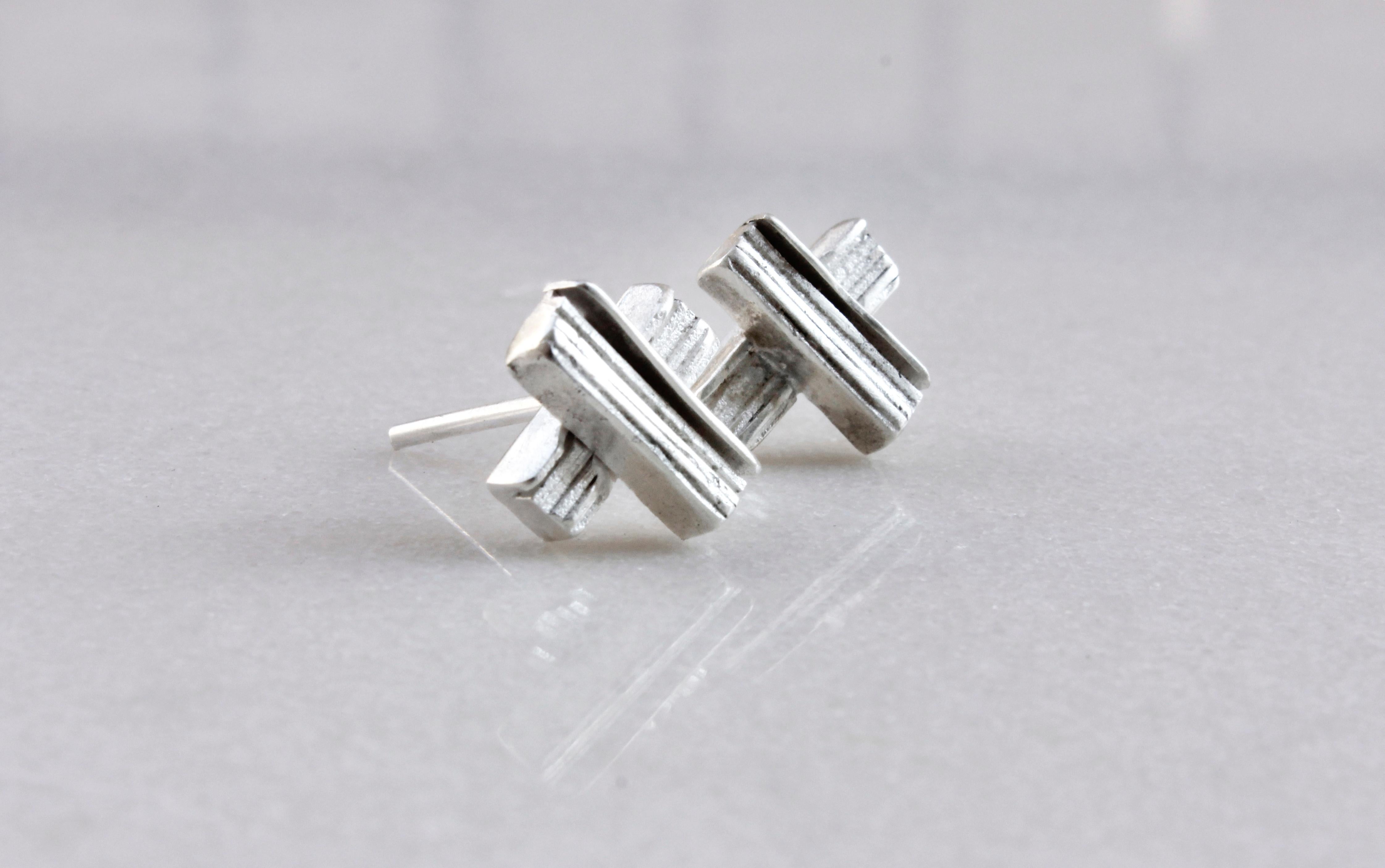 Made from eco silver sheets soldered together, in order to create this unique texture of layers.

The earrings are part of project_x, a collection inspired by the electronic music era.

Length: 0.8 Centimetres

Width: 0.8 Centimetres