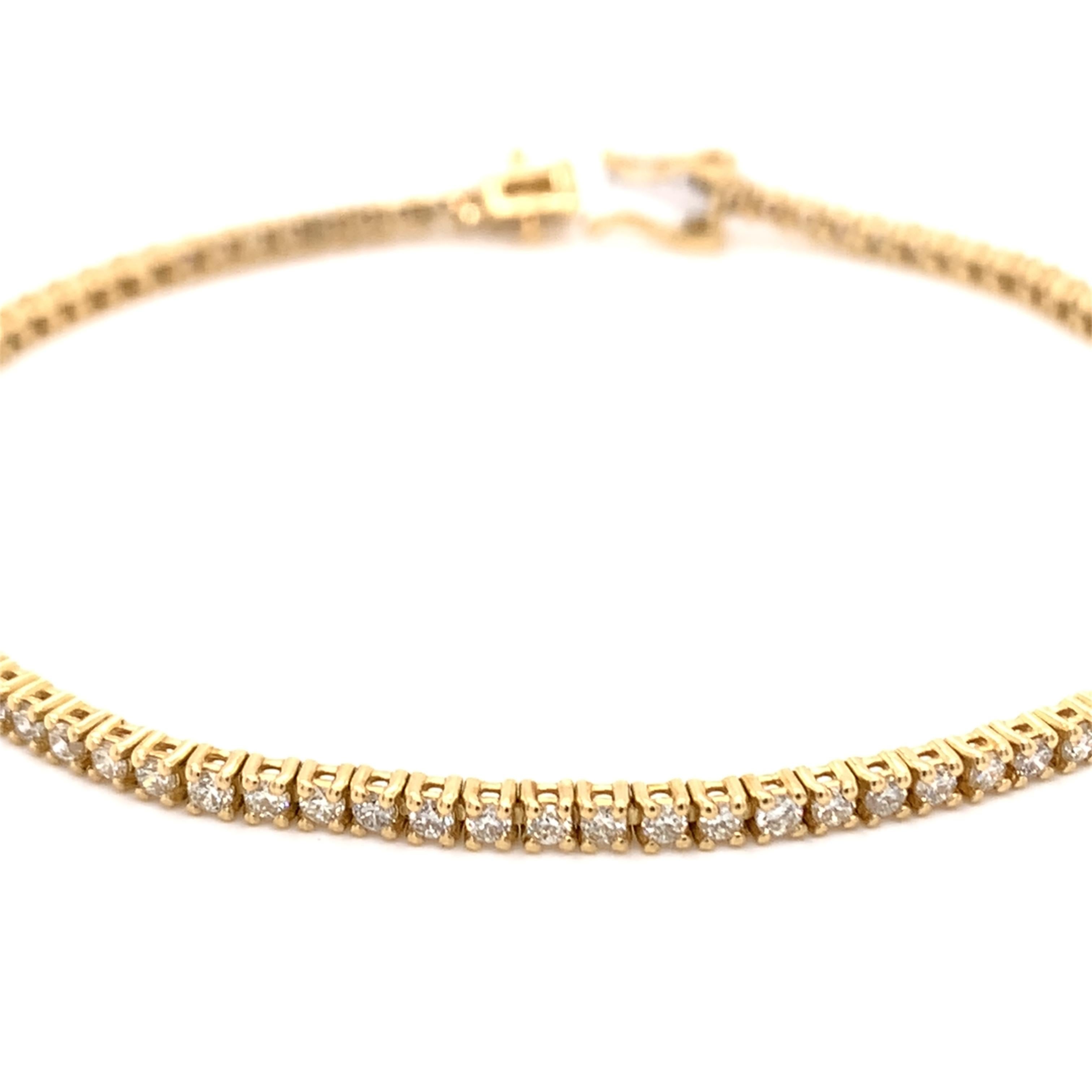 Thin diamond tennis bracelet made with real/natural brilliant cut diamonds. Total Diamond Weight: 1.53 carats. Diamond Quantity: 86 (round diamonds). Color: G. Clarity: SI. Mounted on 18kt yellow gold.