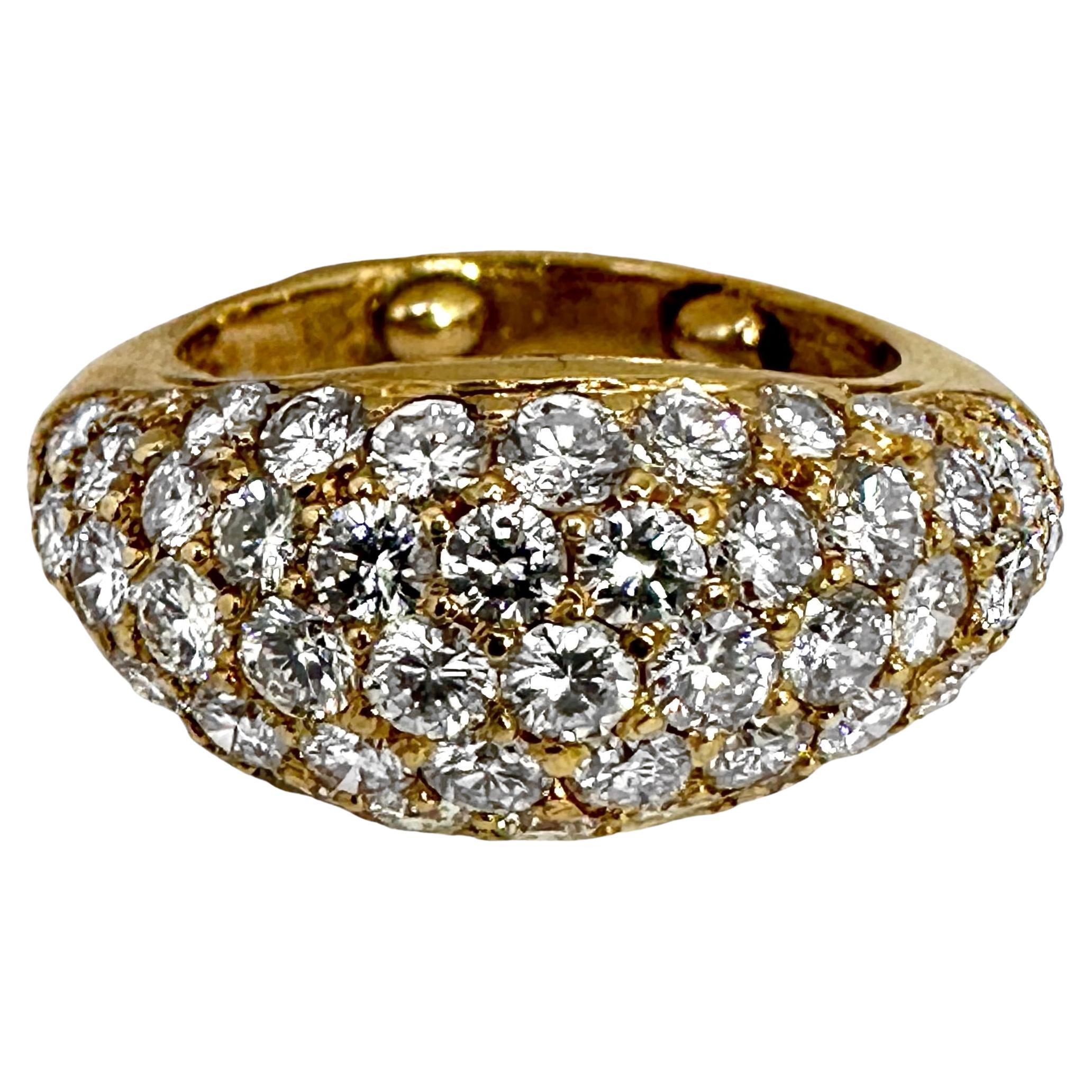 An 18K yellow gold smaller scale ring, pave' set with approximately 2.33ct of round brilliant cut diamonds. There is plenty of sparkle to this diminutive beauty. Ideal for the lady who wears smaller scale jewelry. It pairs beautifully with the