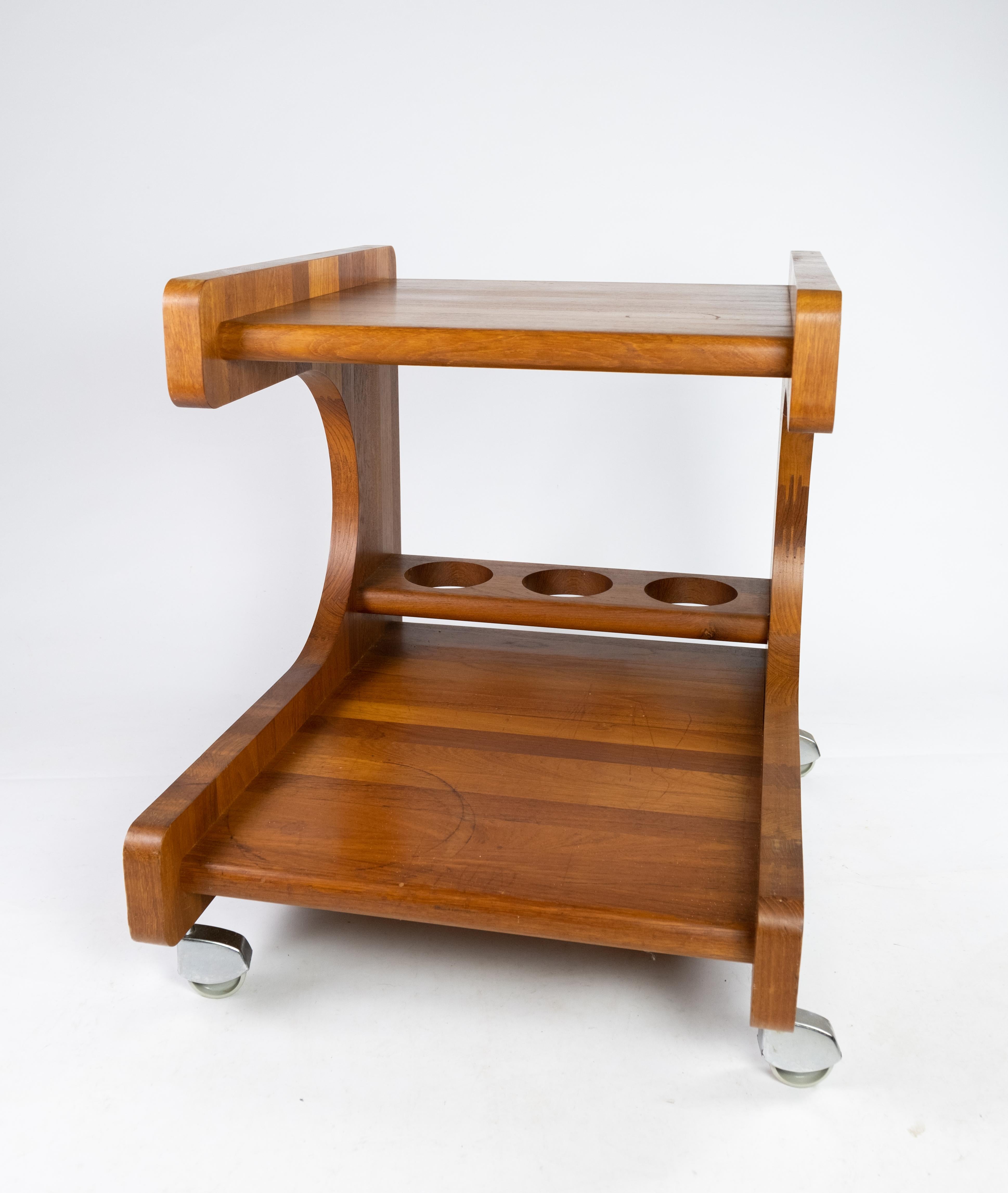 Smaller tray table or bar cart in teak of Danish design from the 1960s. The table is in great vintage condition.