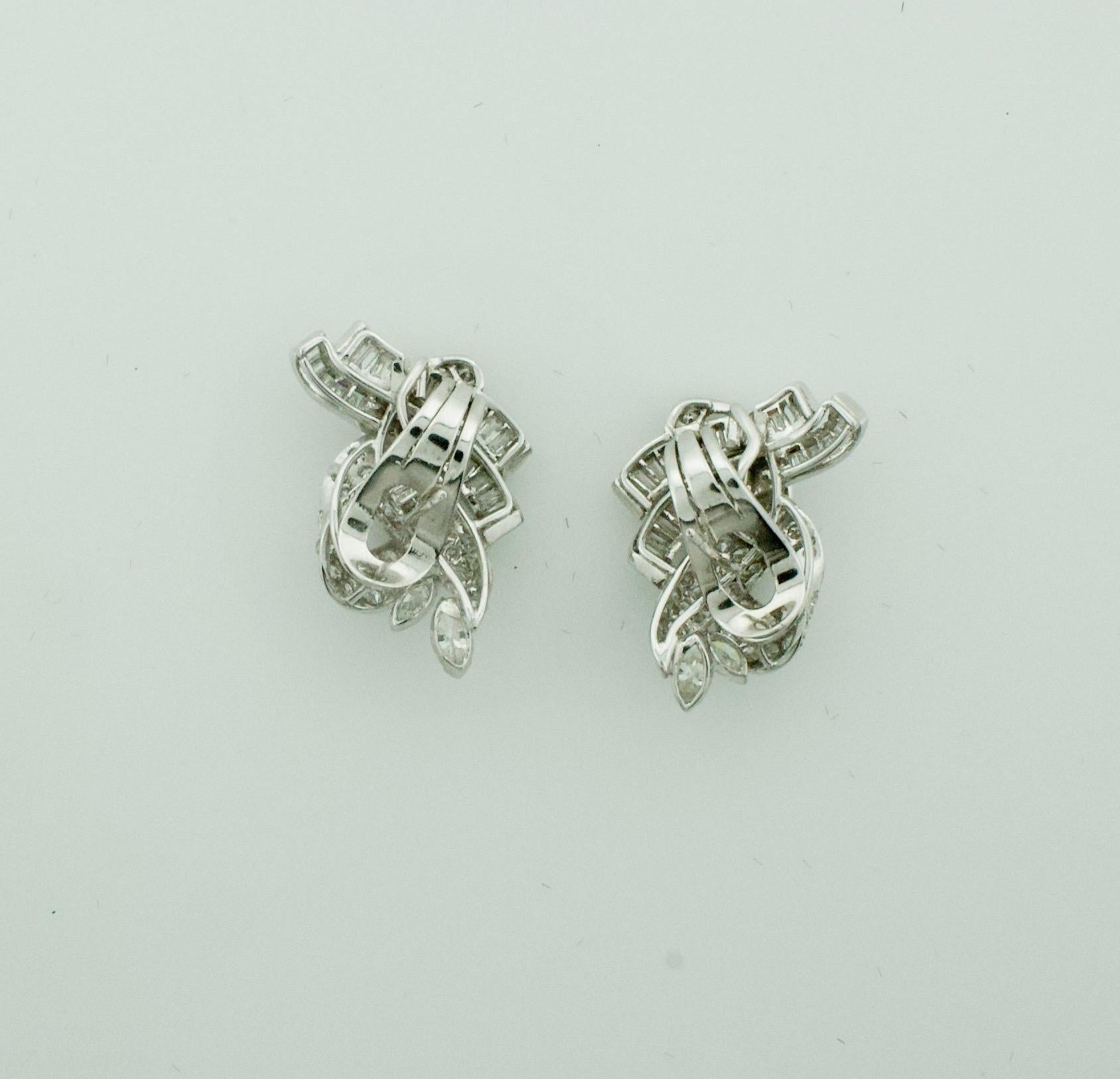 Smart and Sexy Platinum Diamond Earrings Circa 1940's 4.00 Carats Total Weight
Four Marquise Cut Diamonds Weighing .60 Carats Approximately 
48 Baguette Cut Diamonds Weighing 1.75 Carats Approximately 
72 Round Cut Diamonds Weighing 1.65 Carats